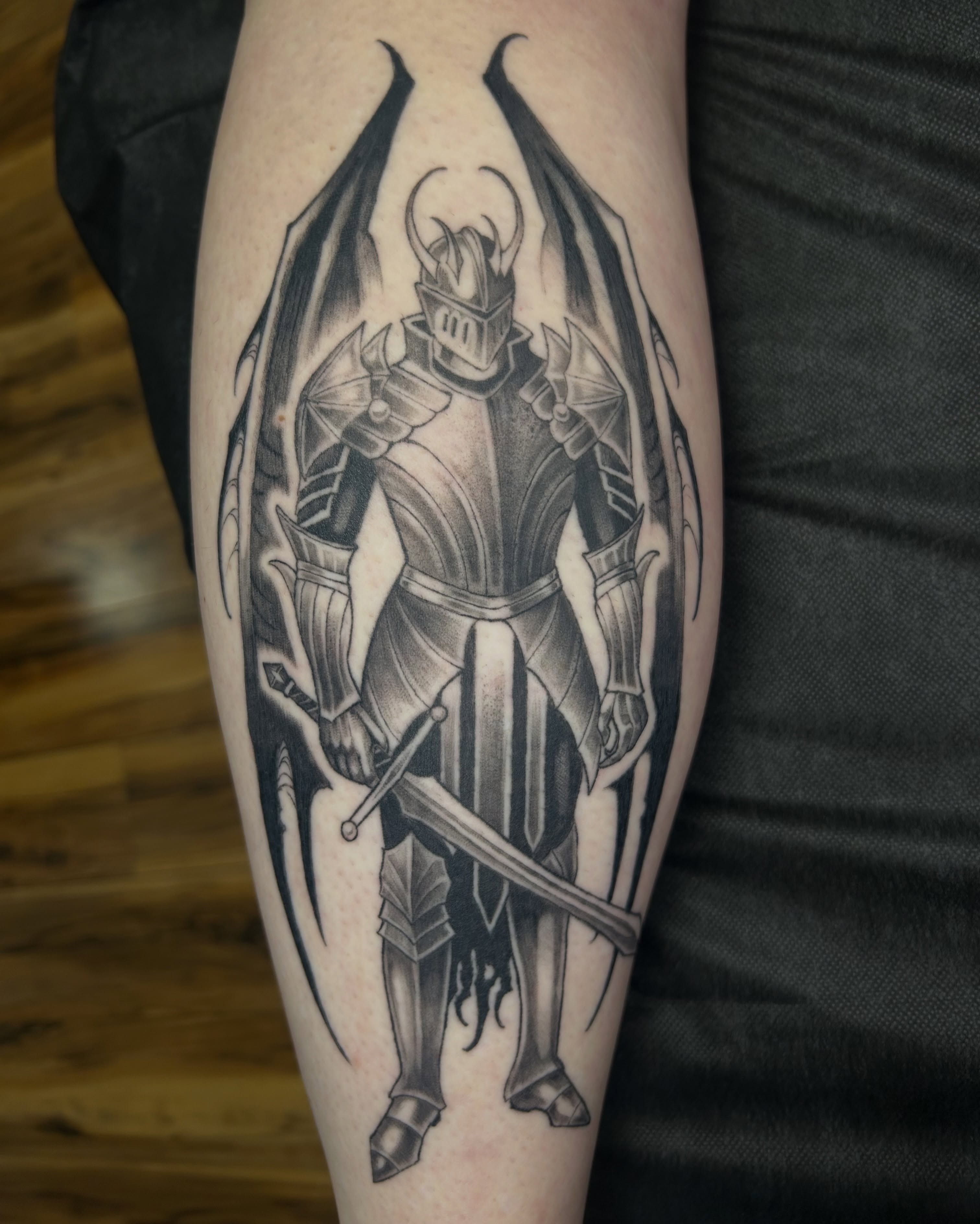 Knight black and grey tattoo on the forearm by Magnus