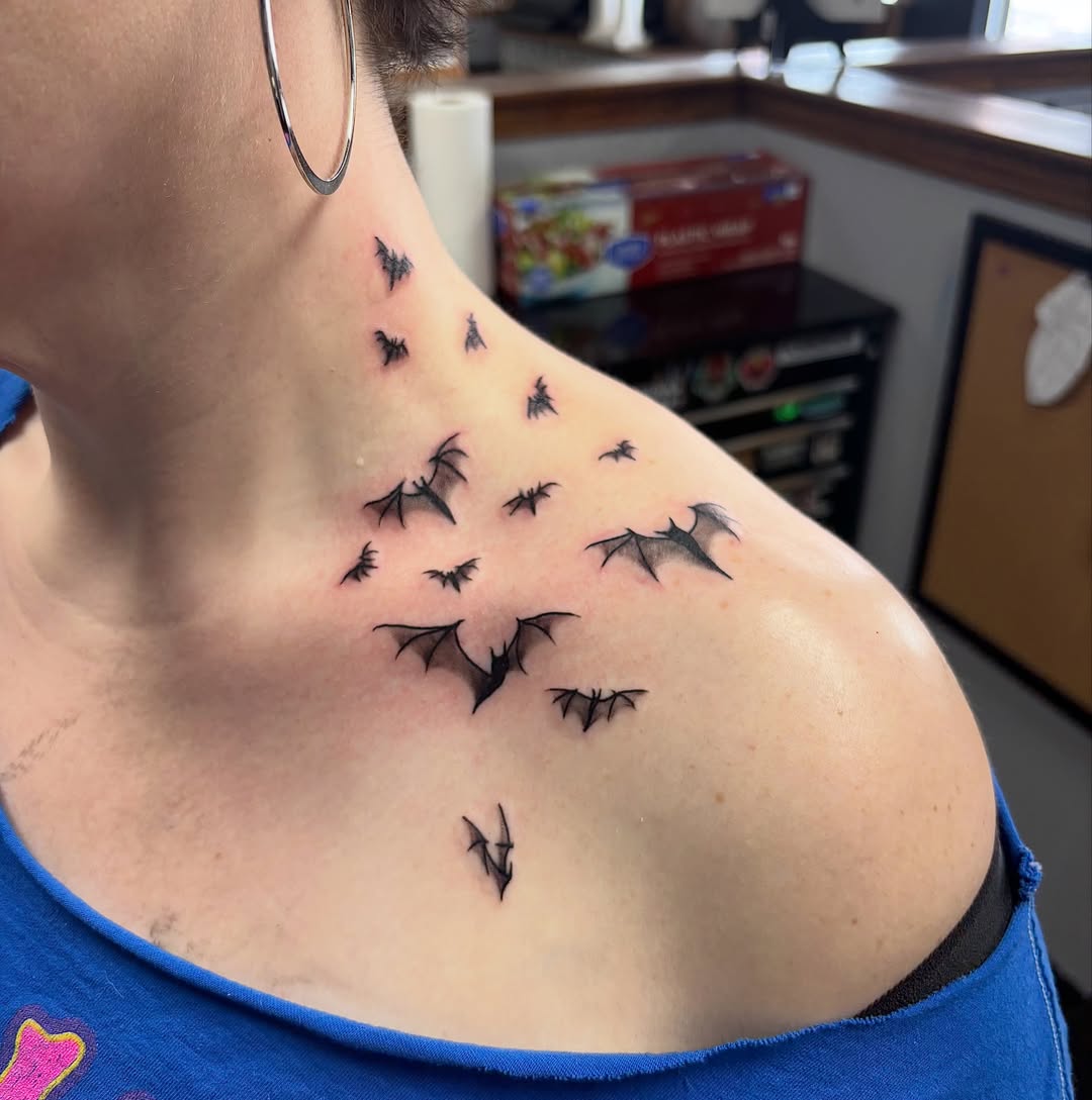 Bat swarm dotwork tattoo on the shoulder by Dyllan Shipley
