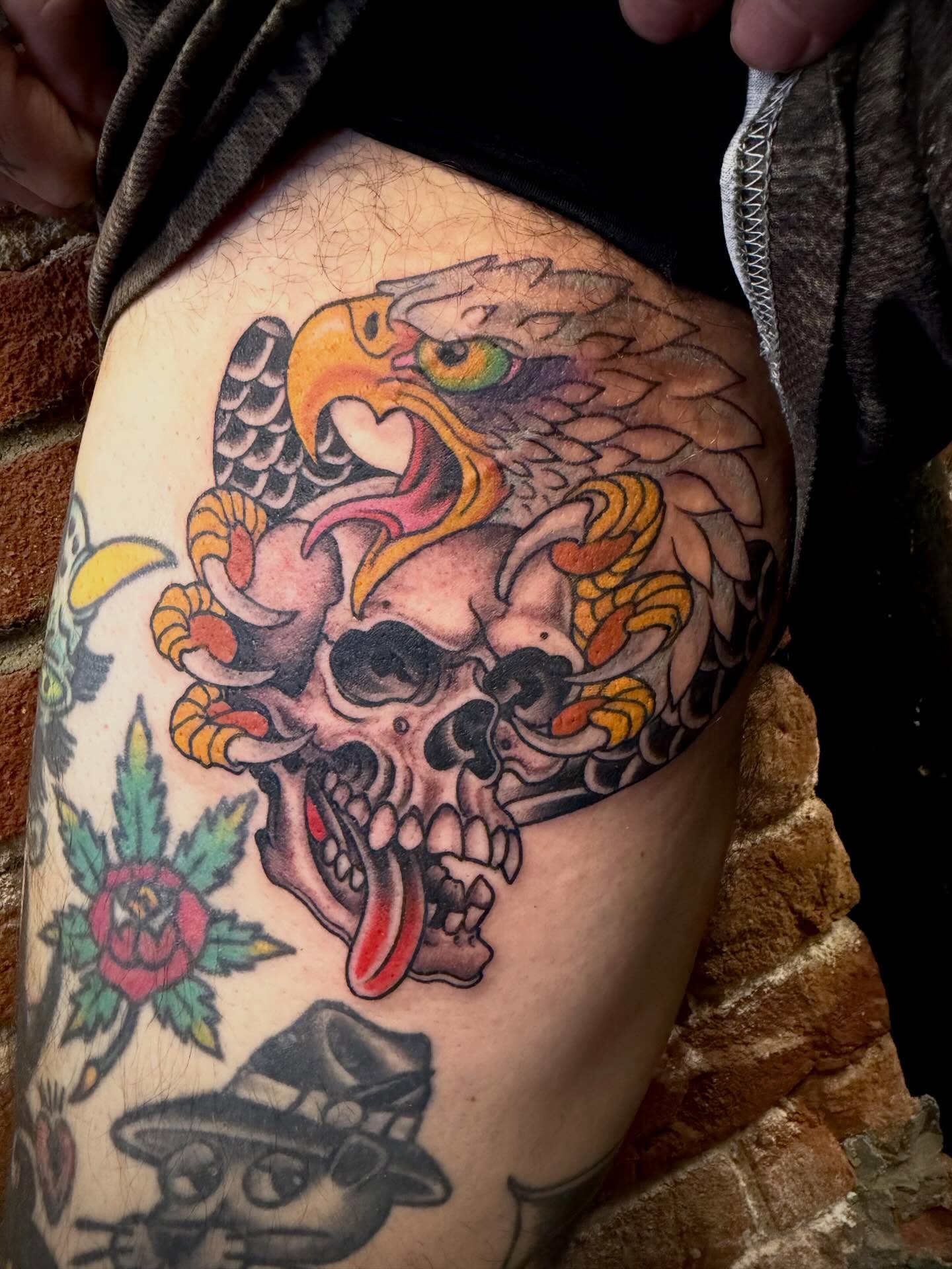 Skull and eagle American traditional tattoo on the thigh by Adam Warmerdam, Los Angeles, California