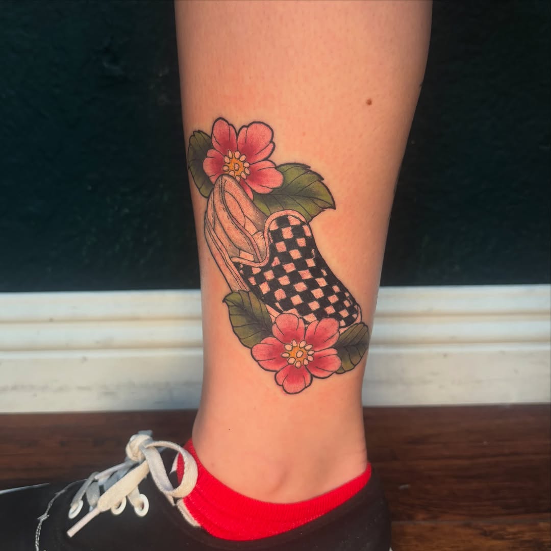 Sneaker and flowers American traditional tattoo on the calf by Emma ๐