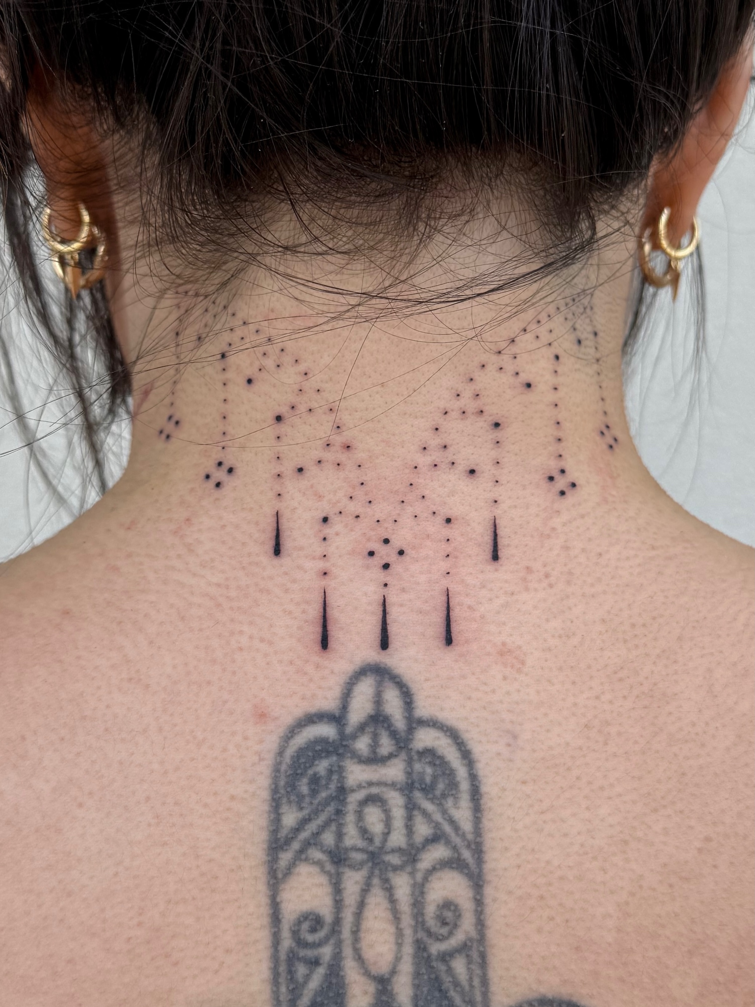 Dotwork pattern dotwork tattoo on the neck by Abby Robinson