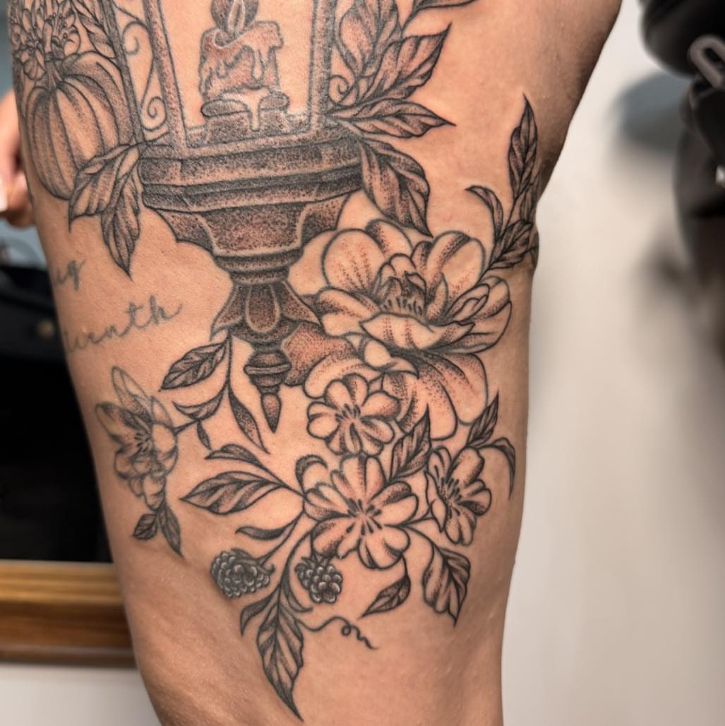 Floral arrangement realism tattoo on the forearm by Destiny A