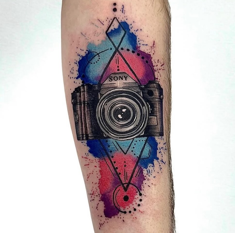 Tattoo by @ashestoashestattoo — geometric, watercolor
