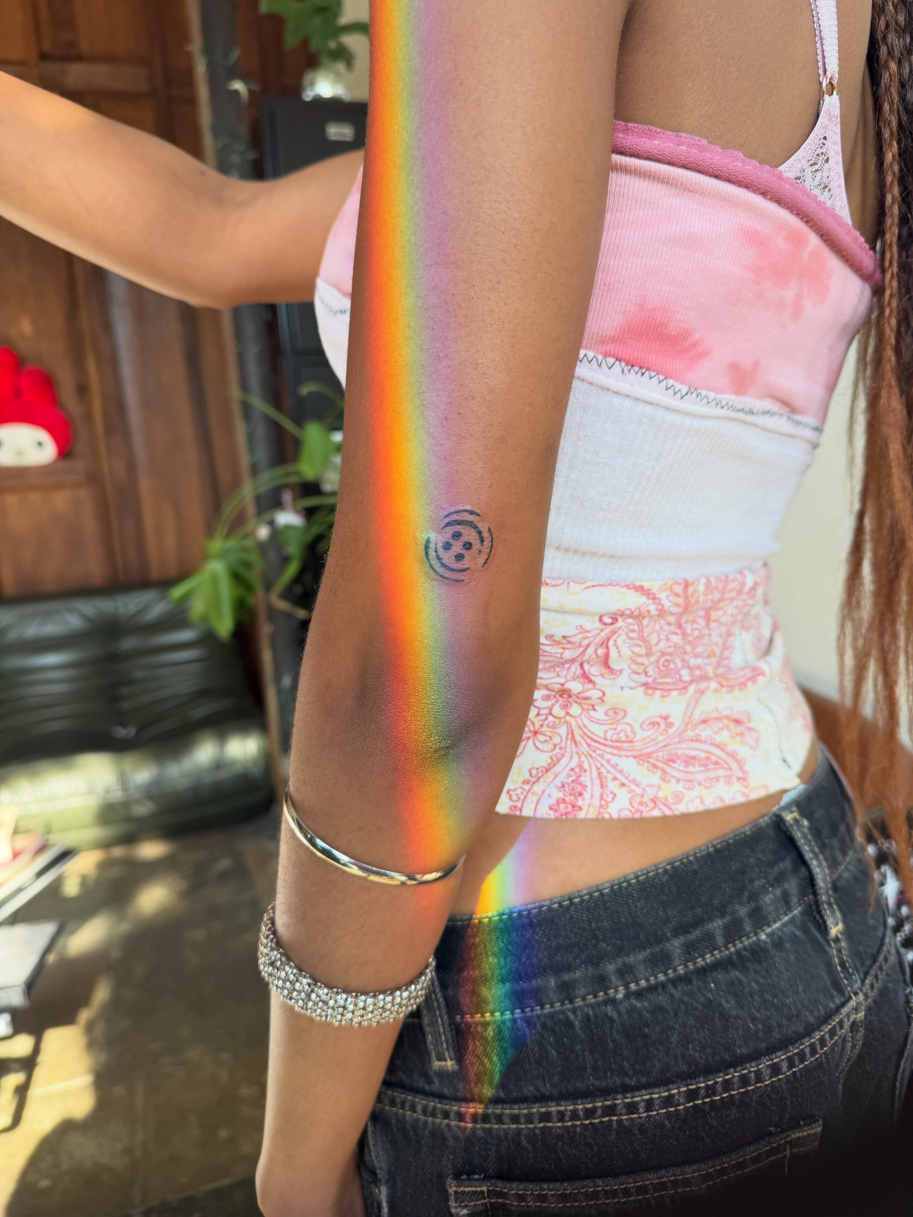Rainbow dotwork tattoo on the upper arm by nova ♡ˎˊ˗ tattoo apprentice