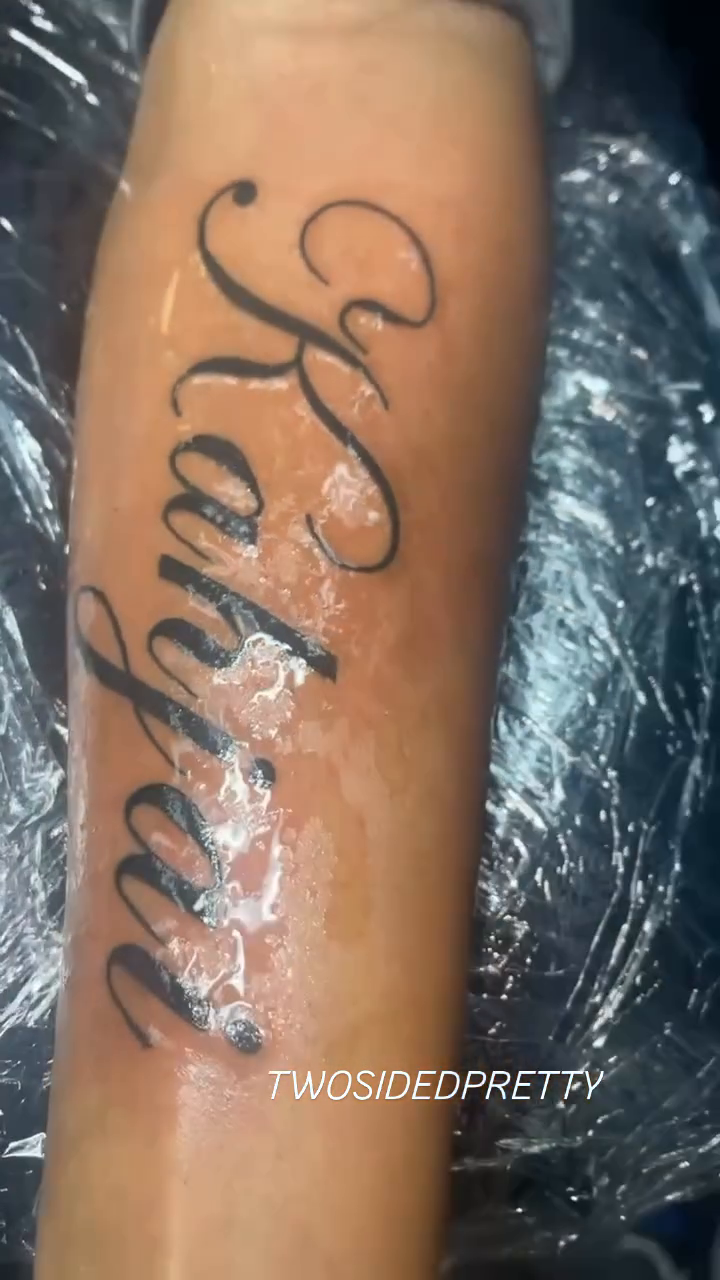 Kahjai lettering tattoo on the forearm by @twosidedpretty