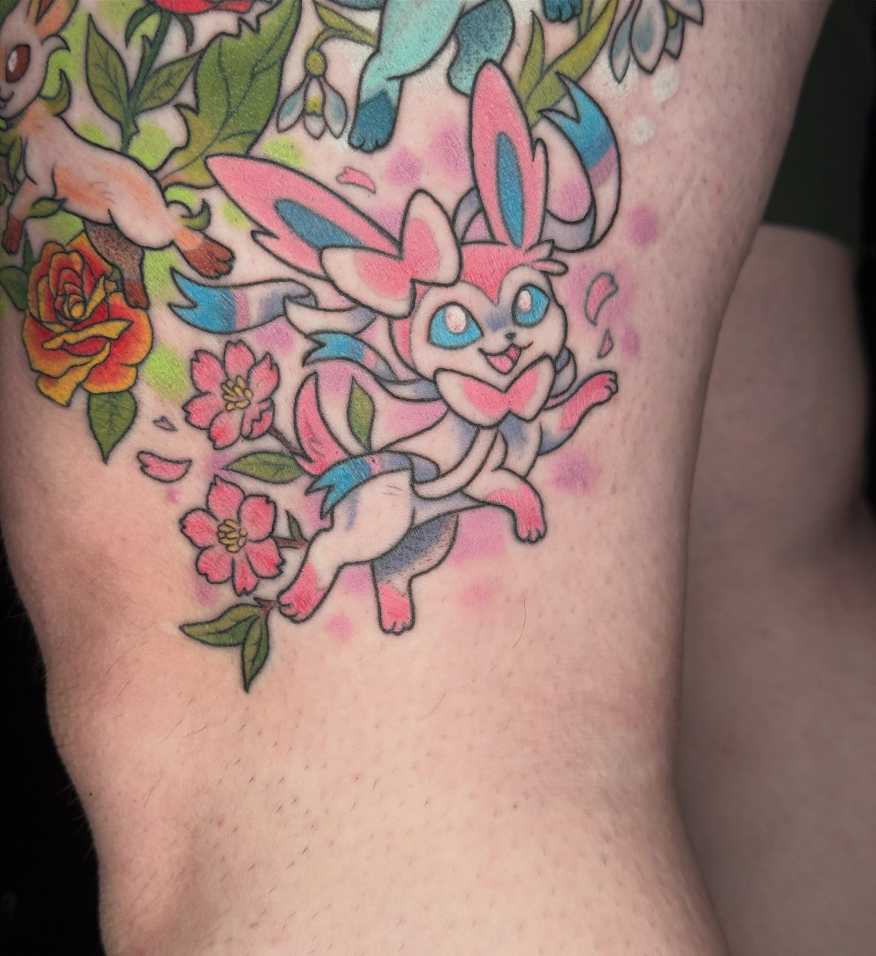 Jolteon anime tattoo on the thigh by liam u. williams