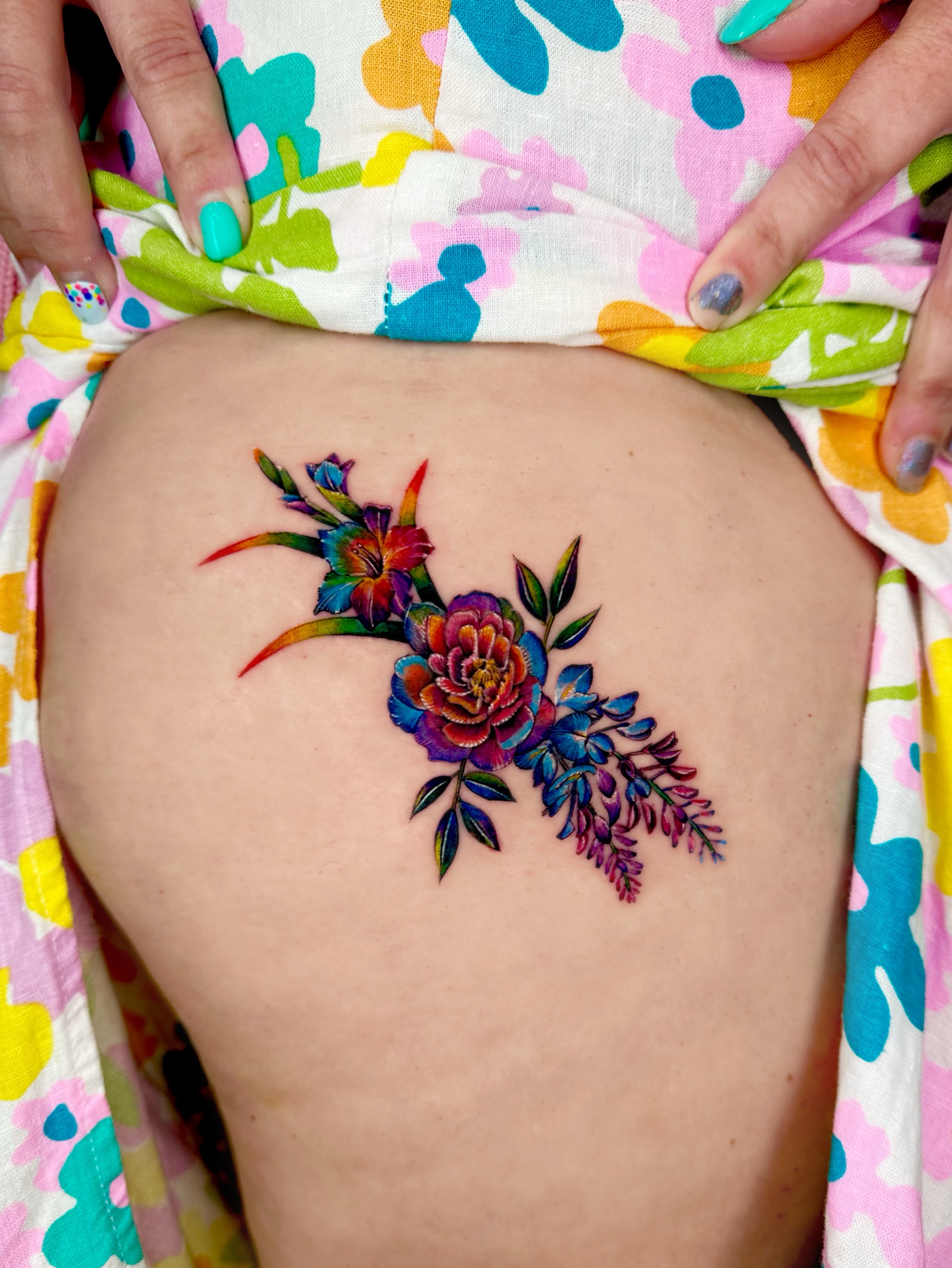 Floral bouquet new school tattoo on the thigh by Claire