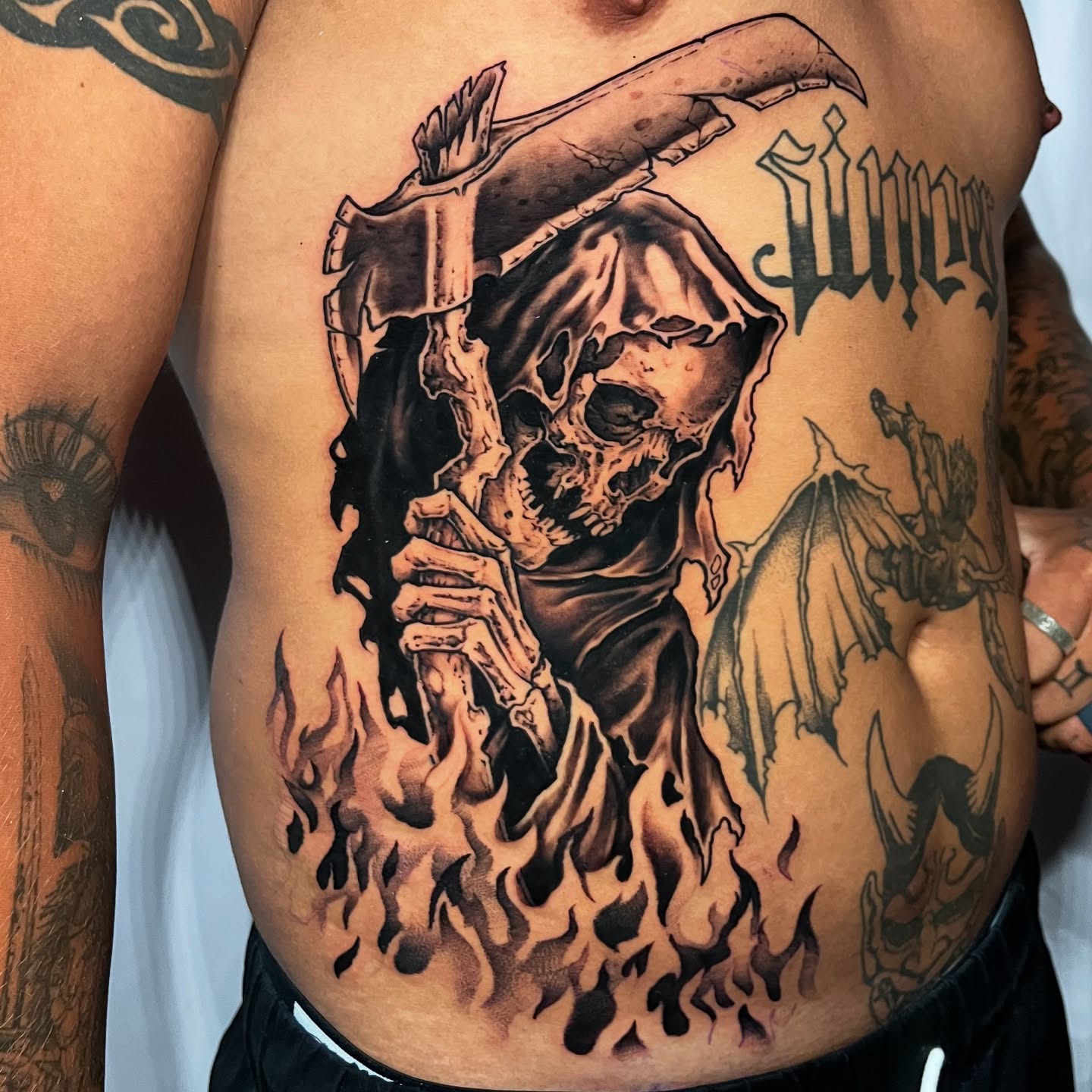 Grim reaper dark realism tattoo on the chest by Cameron Jenkins