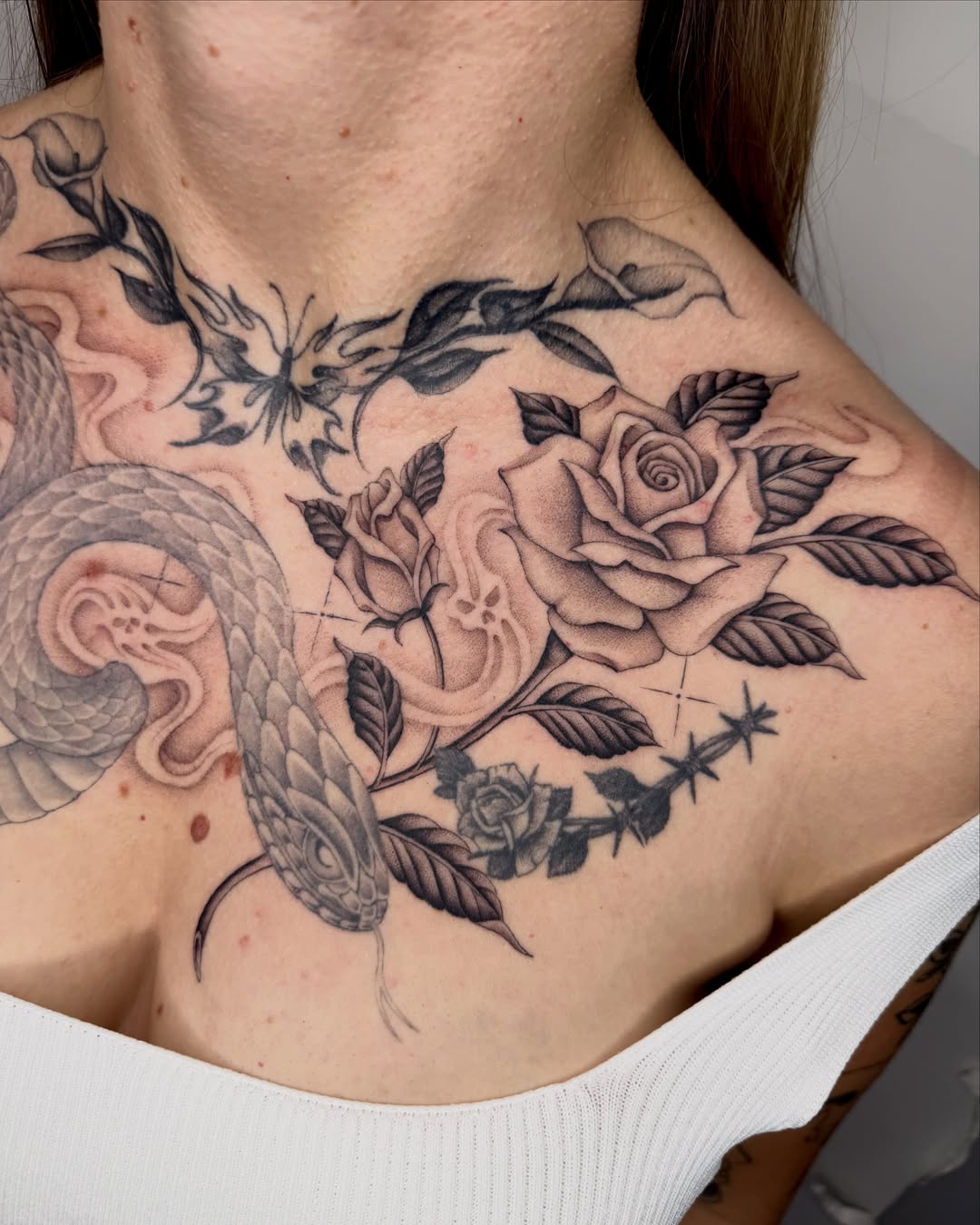 Snake and roses realism tattoo on the chest by IVY