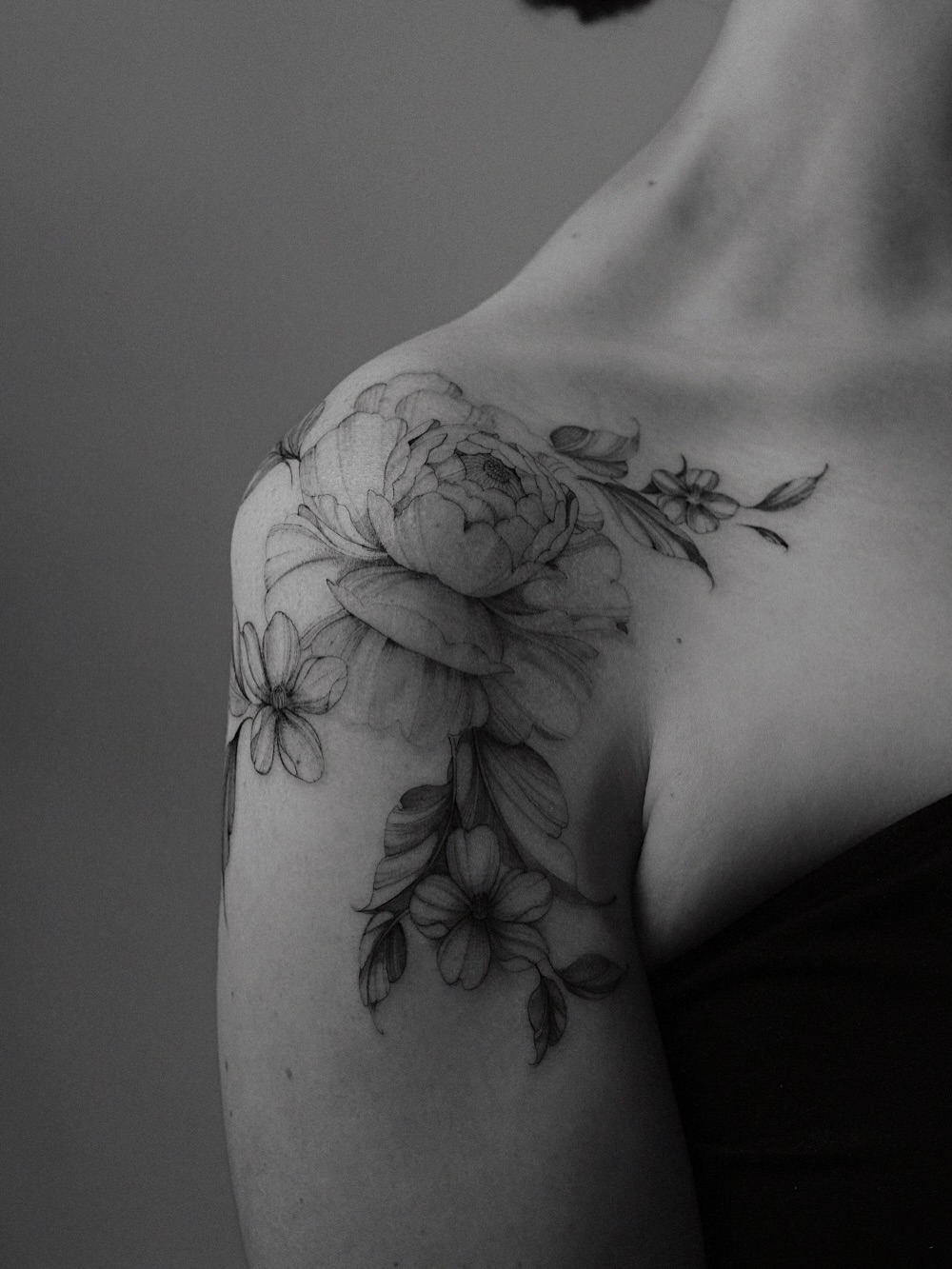 Floral bouquet realism tattoo on the shoulder by Temple Adorned Tattoo