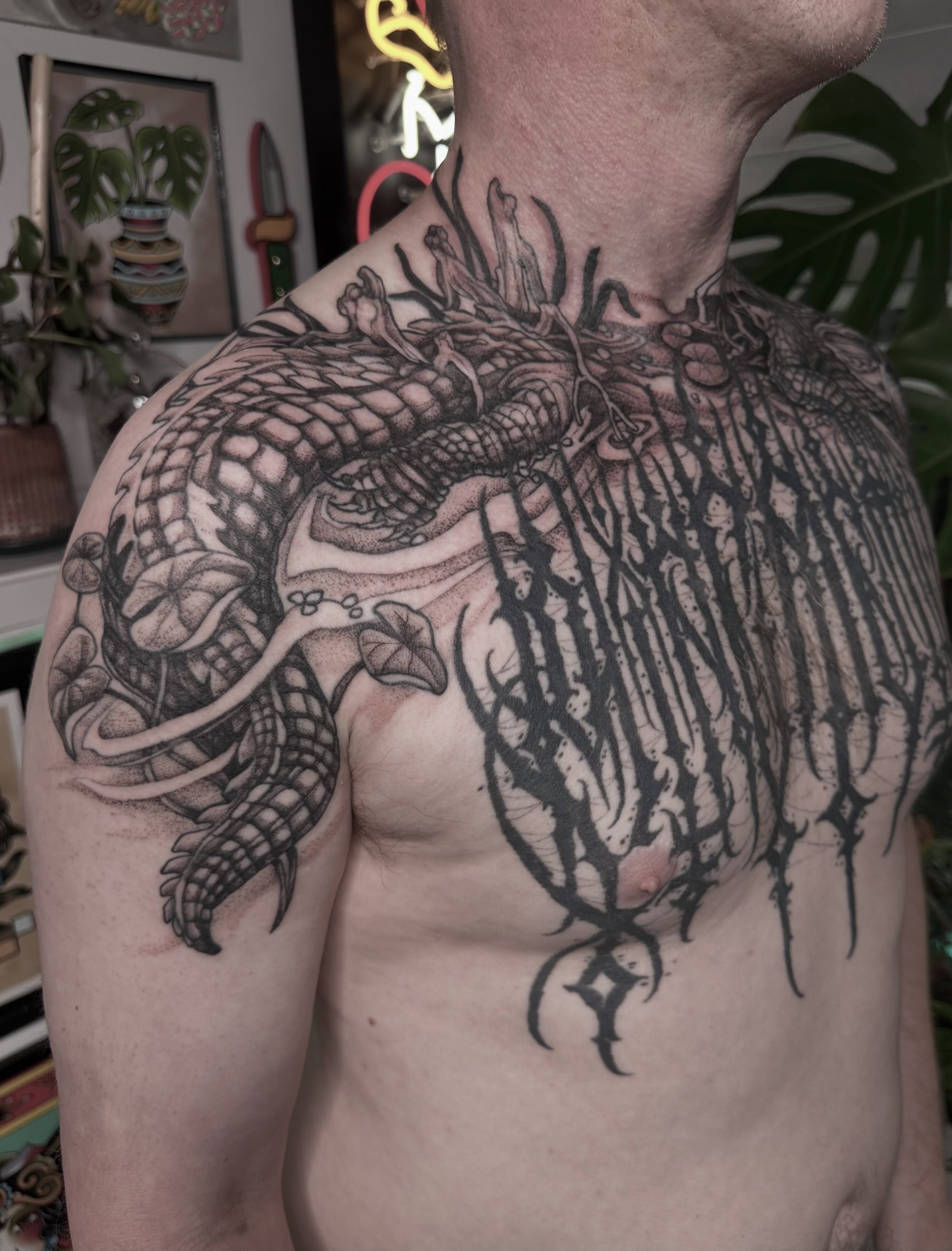 Dragon and wings dotwork tattoo on the chest by Cassidy Depew, Seattle, Washington