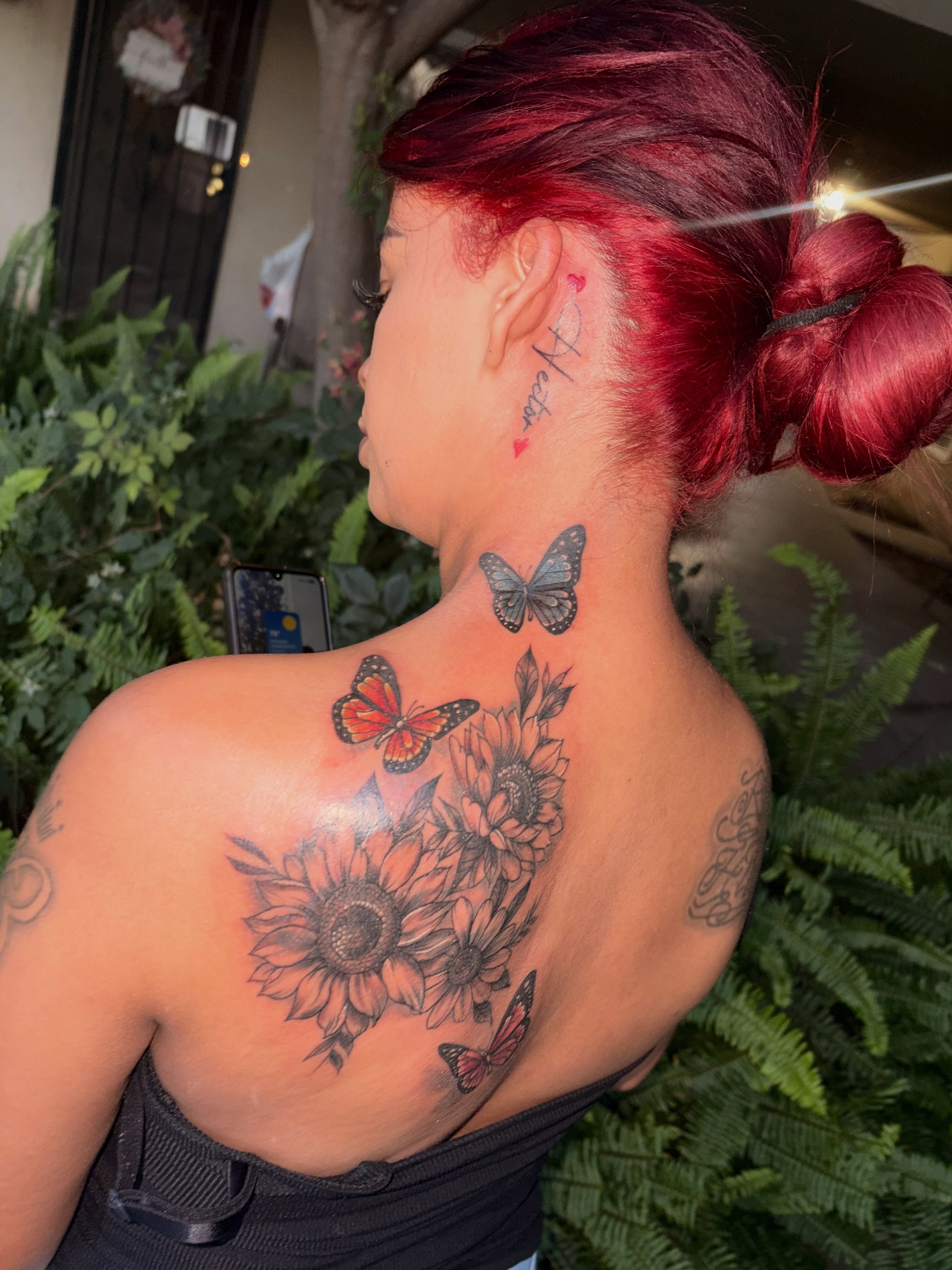 Sunflowers and butterflies realism tattoo on the shoulder by Tattoomobile