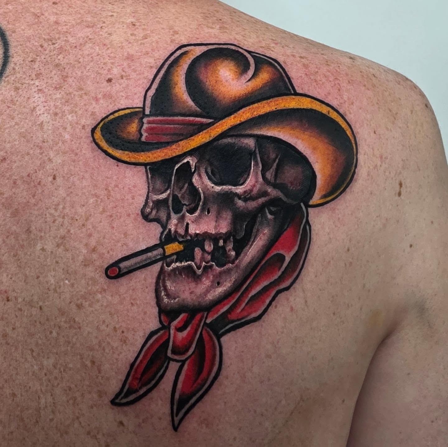 Cowboy skull American traditional tattoo on the shoulder by Tyler Cromwell
