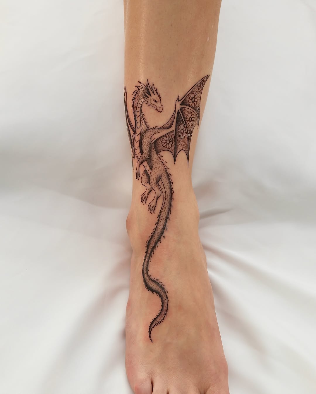 Dragon black and grey tattoo on the calf by Koko