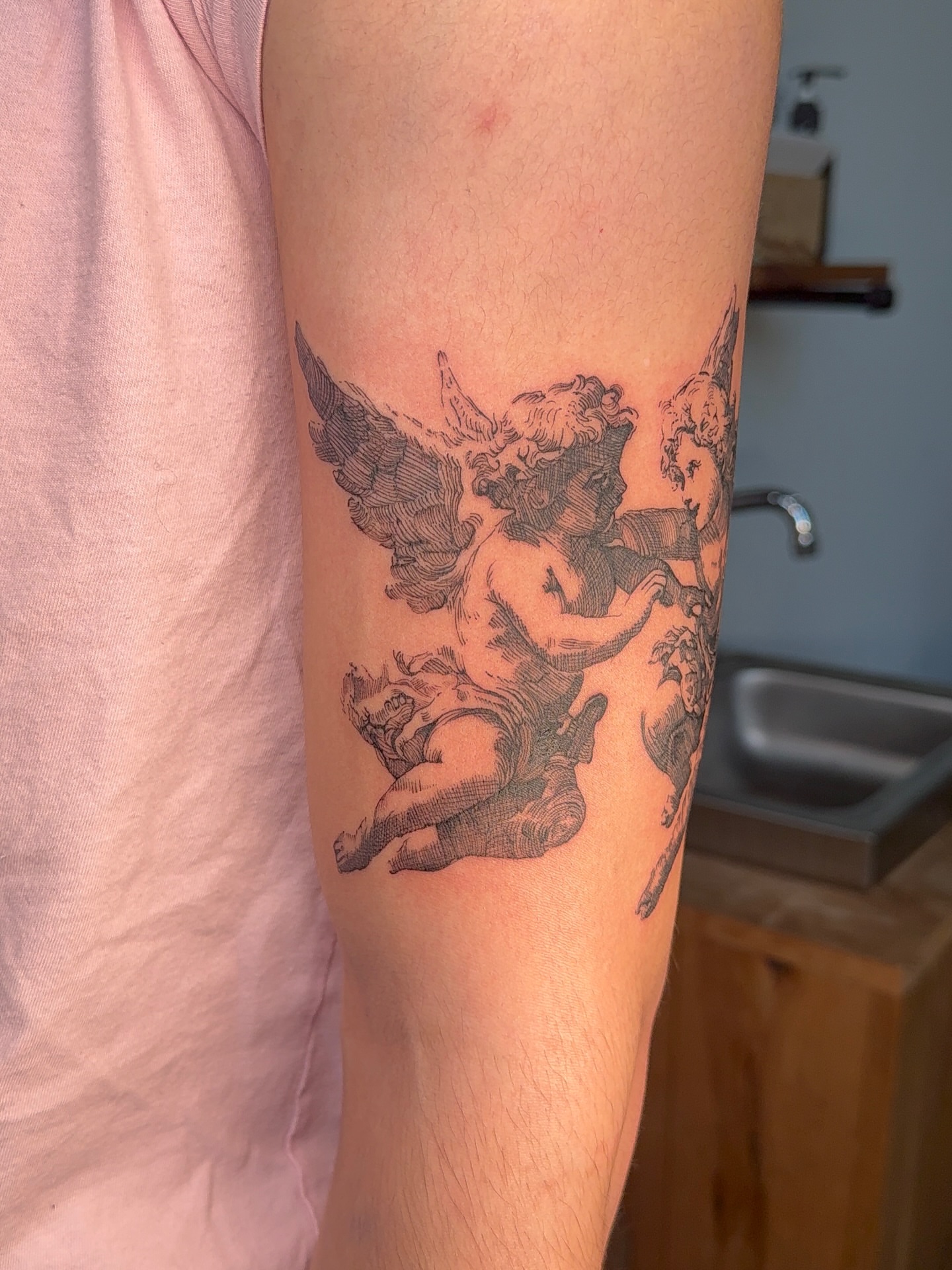 Cherubs black and grey tattoo on the forearm by aamora ꩜