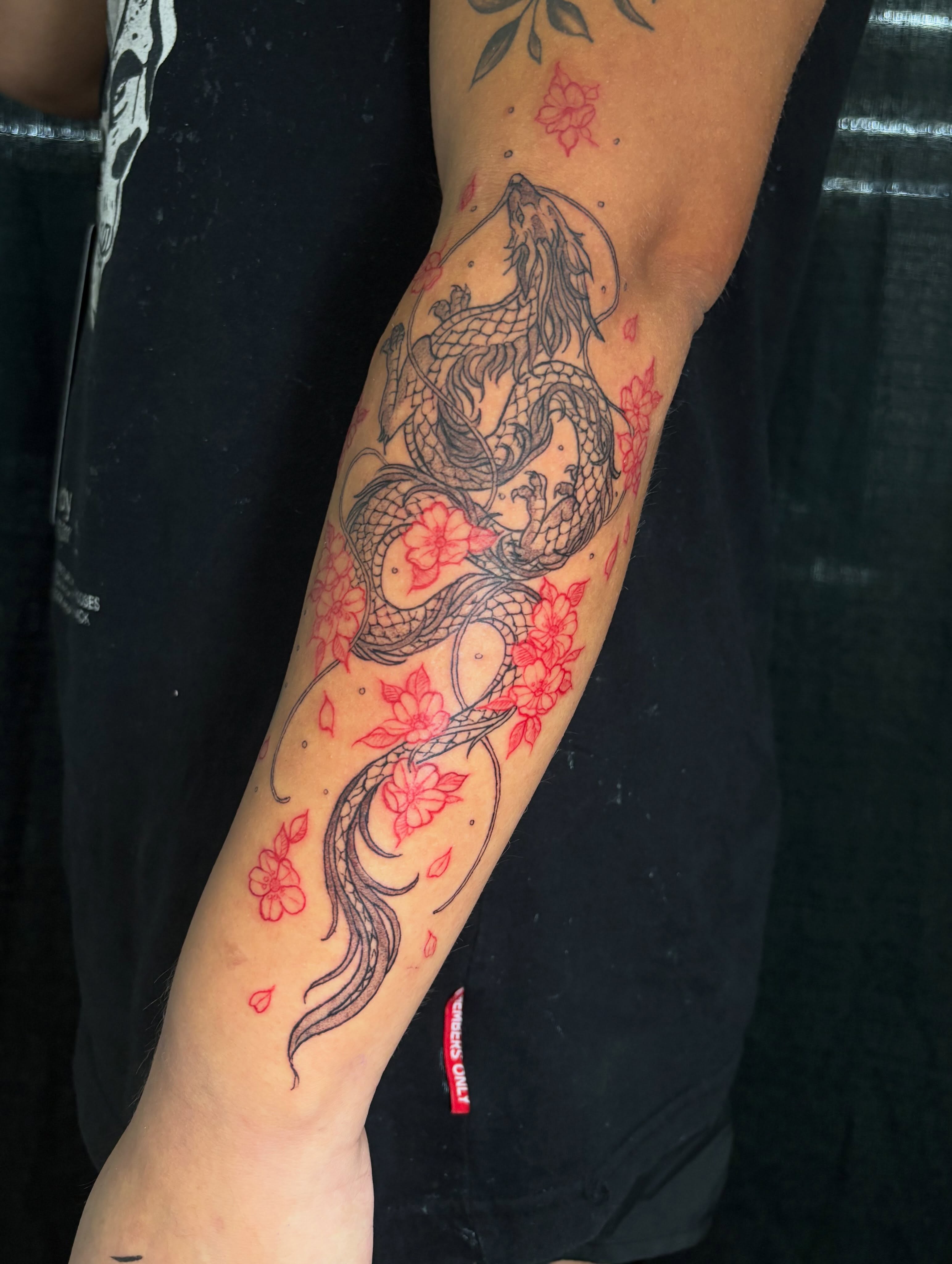 Dragon and flowers dotwork tattoo on the forearm by Shampooh