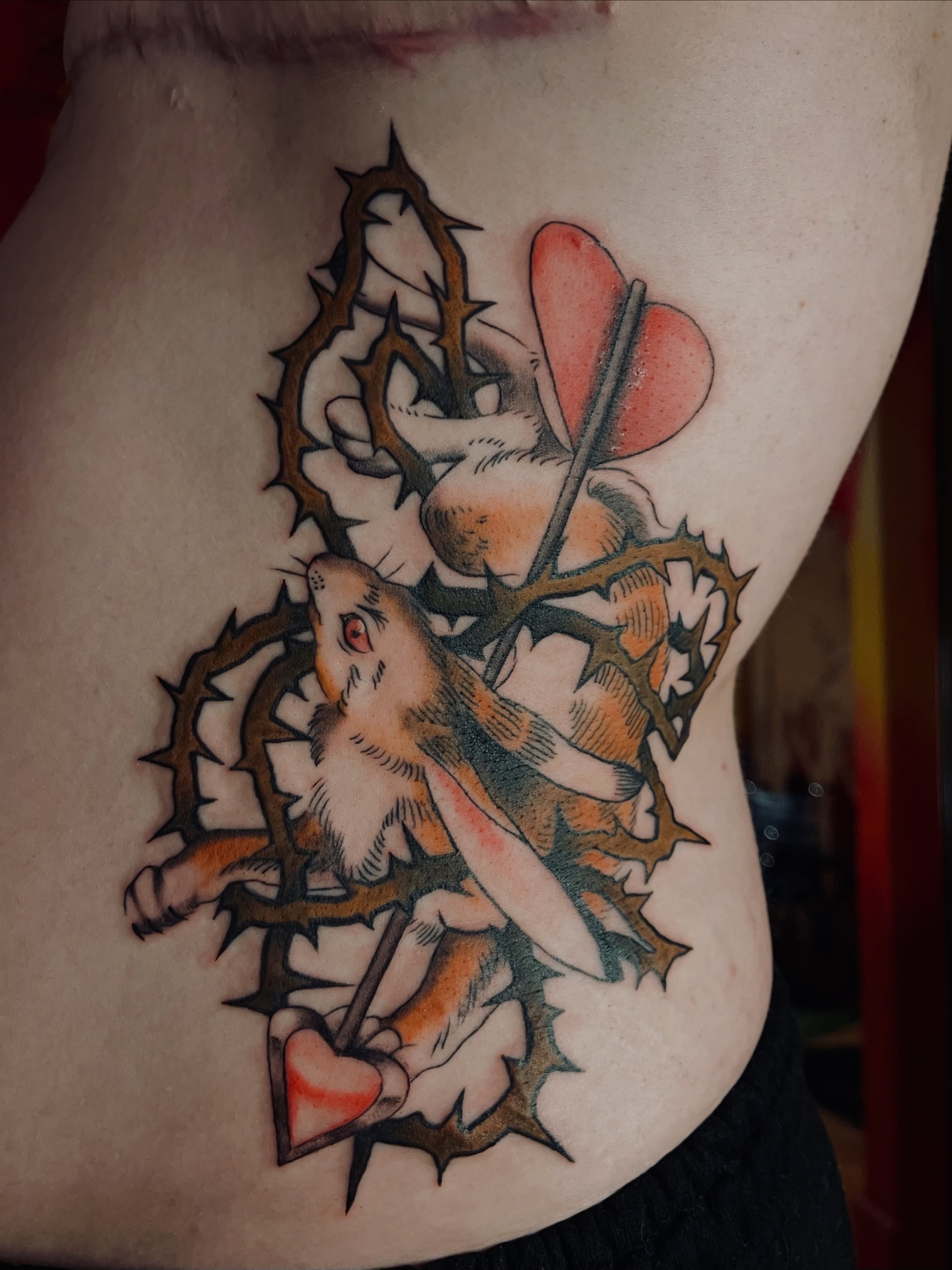 Rabbit and thorns American traditional tattoo on the thigh by Zoe Phan, Richmond, Virginia