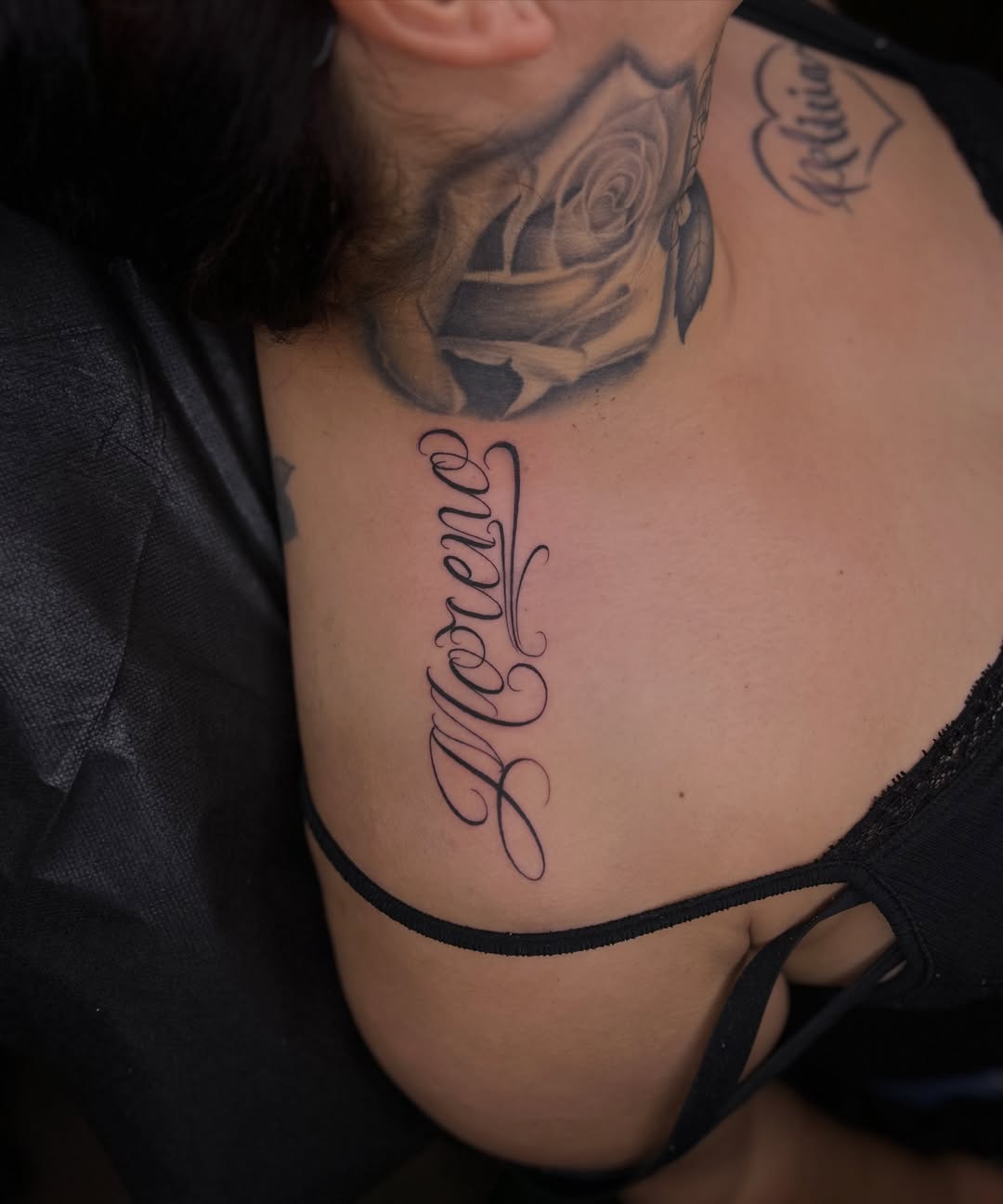 Moreno lettering script tattoo on the chest by Tattoo Artist