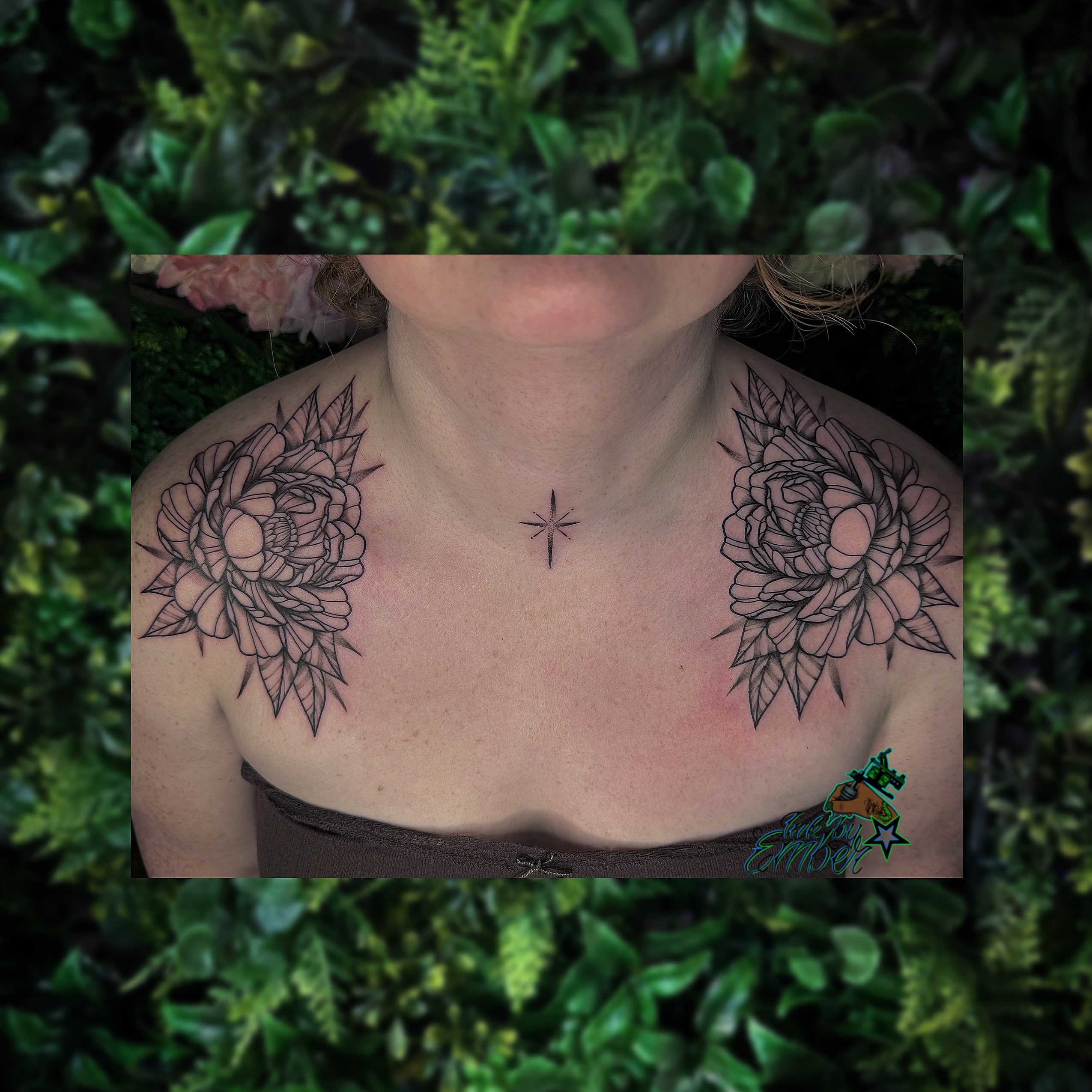 Floral arrangement black and grey tattoo on the chest by Ember