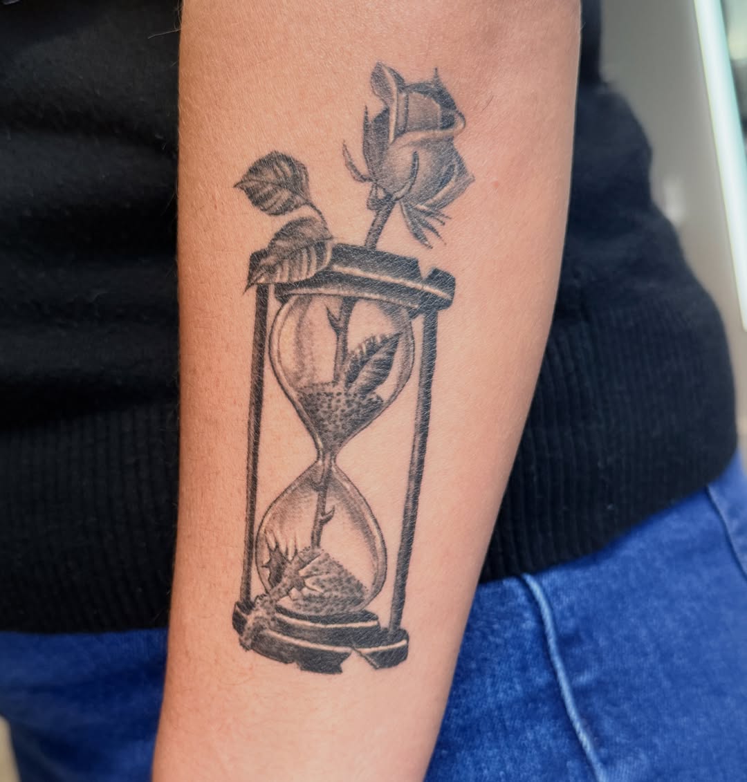 Hourglass and rose black and grey tattoo on the forearm by Sean Rakos, Austin, Texas
