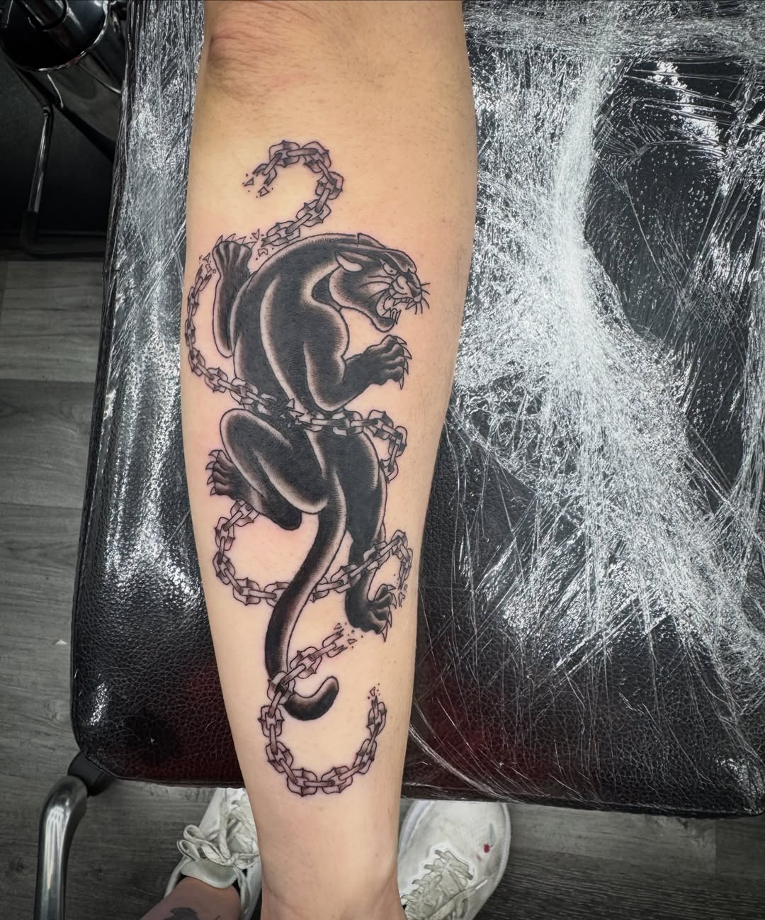 Panther black and grey tattoo on the forearm by Celia