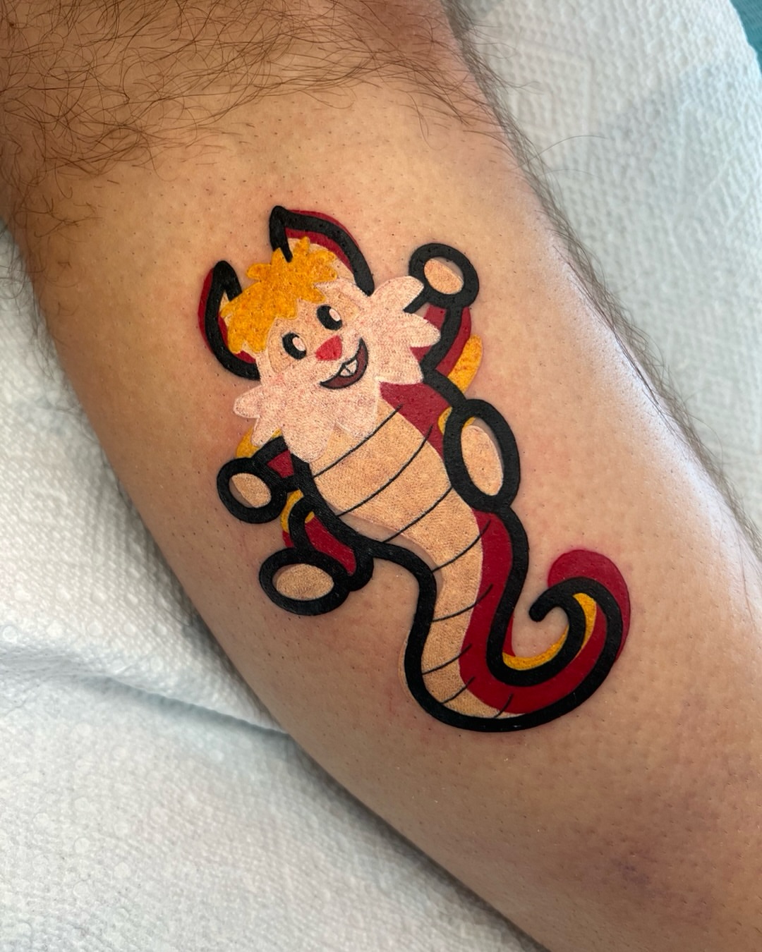 Seahorse character American traditional tattoo on the thigh by Tattoo Artist