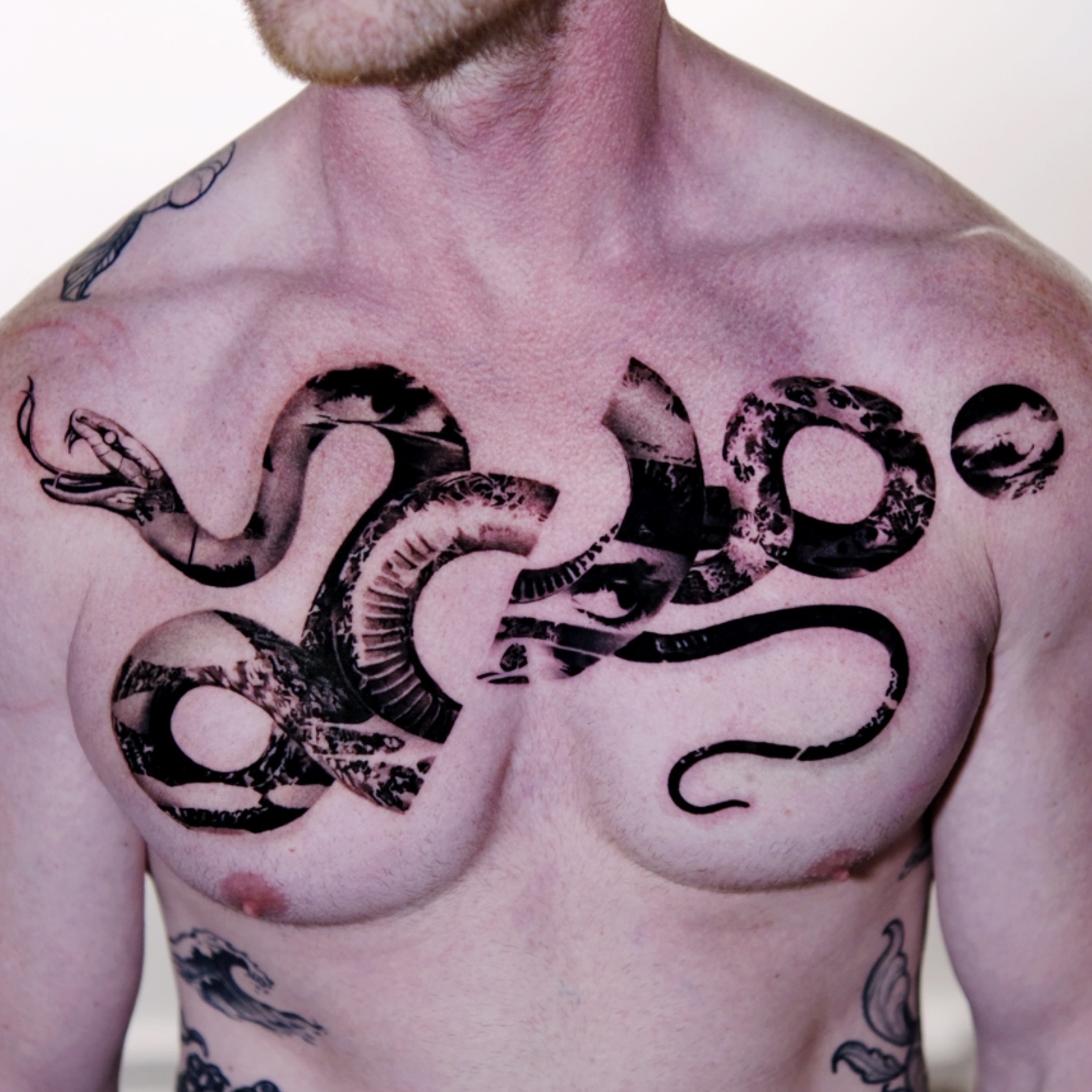 Snake black and grey tattoo on the chest by 𝐌𝐀𝐊𝐒𝐈𝐌 𝐏𝐀𝐓𝐑𝐈𝐂𝐊