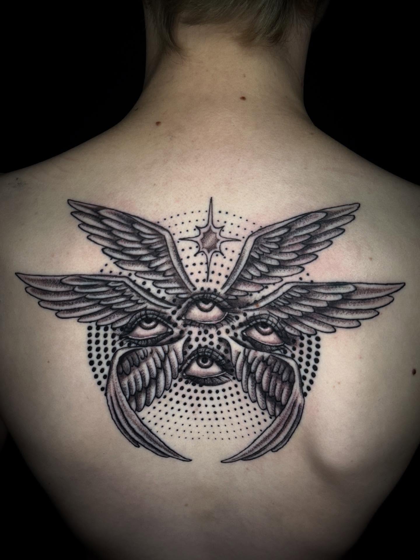 Eye with wings dotwork tattoo on the back by Jacie Aasen-Lupino