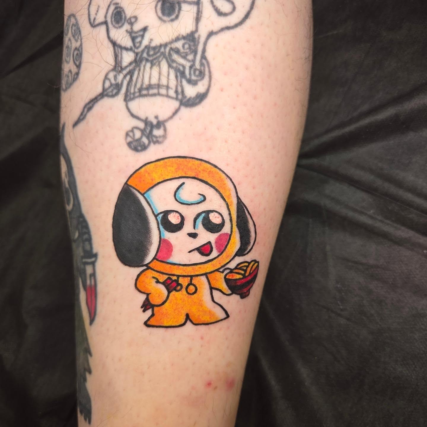 Chibi character anime tattoo on the forearm by Chaz Escobar