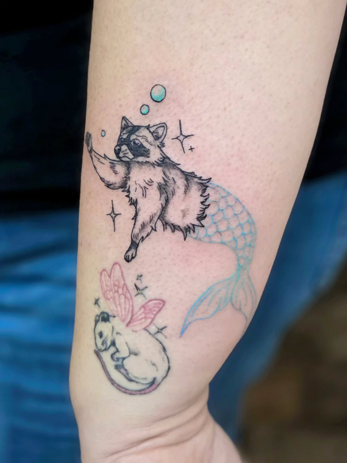 Mermaid and raccoon new school tattoo on the forearm by Courtney, Lakewood, Ohio