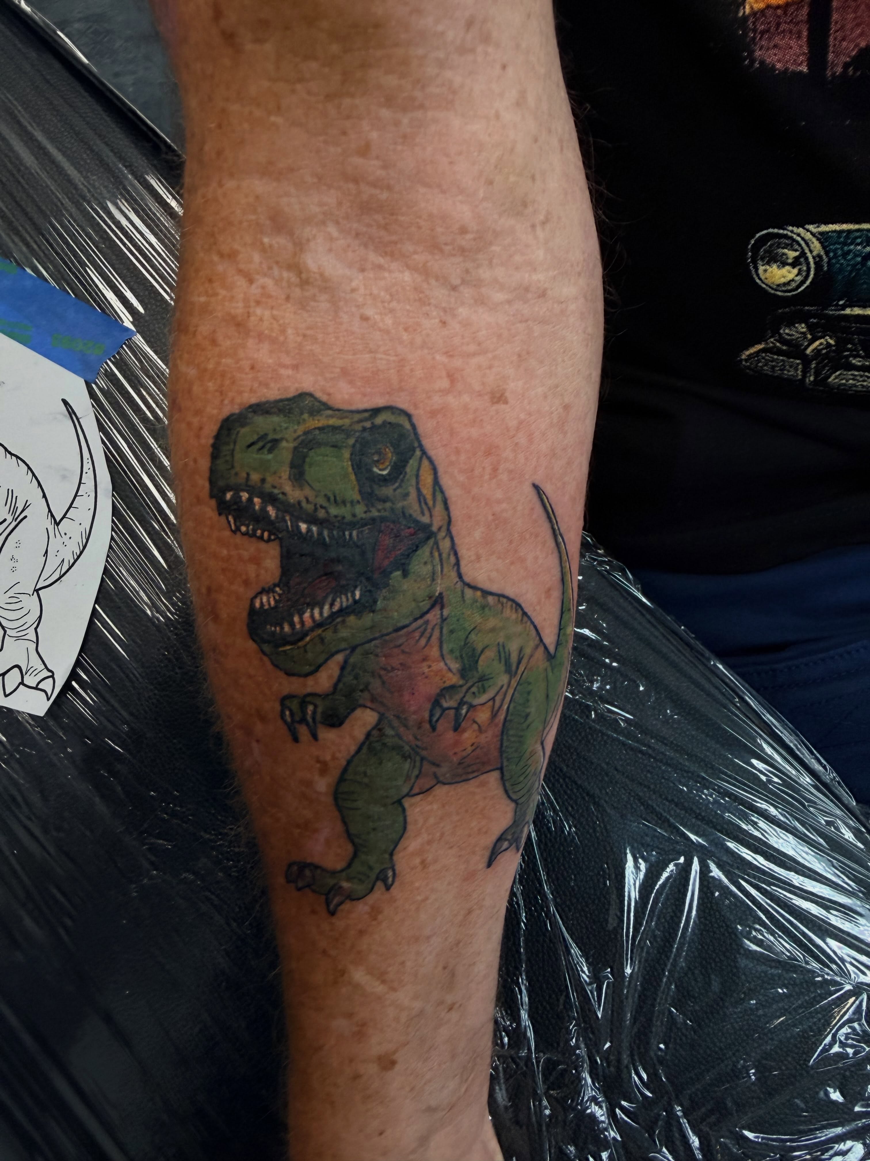 T-rex realism tattoo on the forearm by Rylan Thorndyke - Tattoo Artist, Las Vegas, Nevada