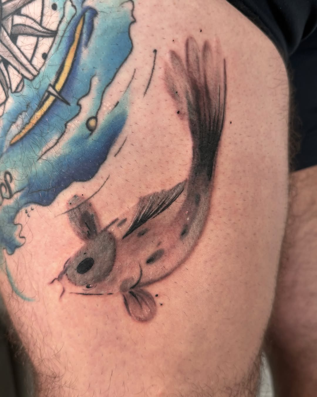 Fish realism tattoo on the thigh by Ricky, Chicago, Illinois