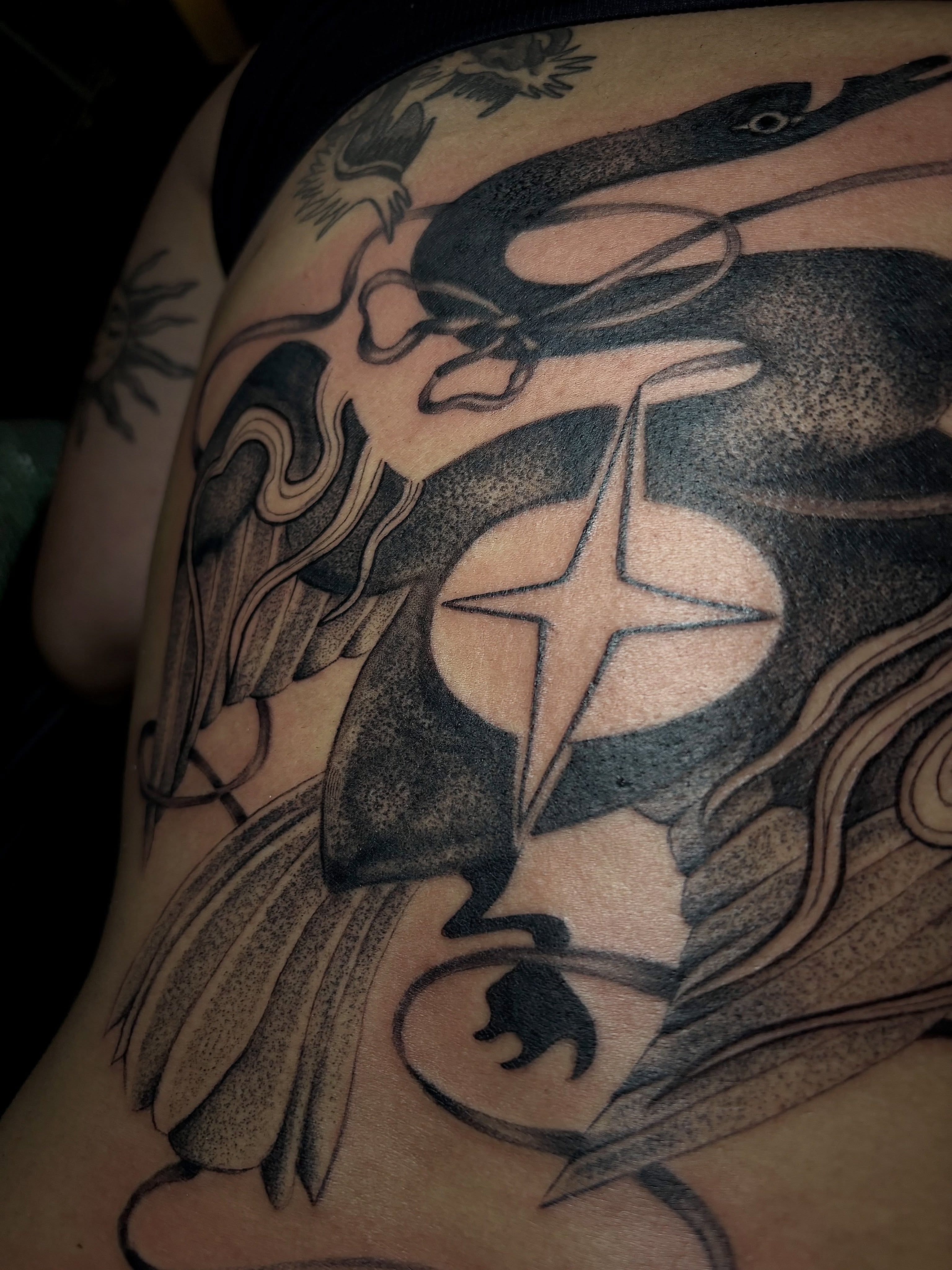Star and abstract shapes dotwork tattoo on the shoulder by Flor, Dallas, Texas