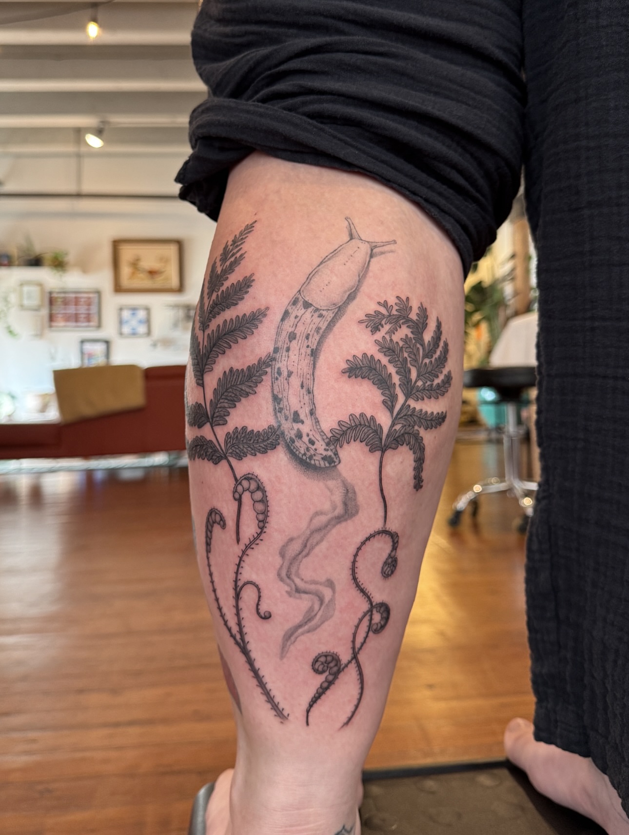 Snail and fern realism tattoo on the thigh by Jasmine, Lynnwood, Washington