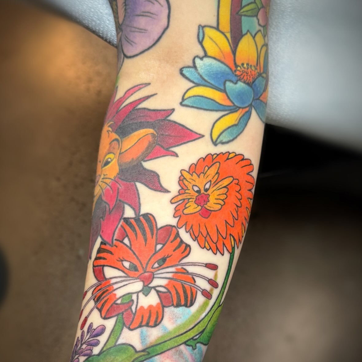 Floral bouquet American traditional tattoo on the forearm by San Diego Tattoo Artist