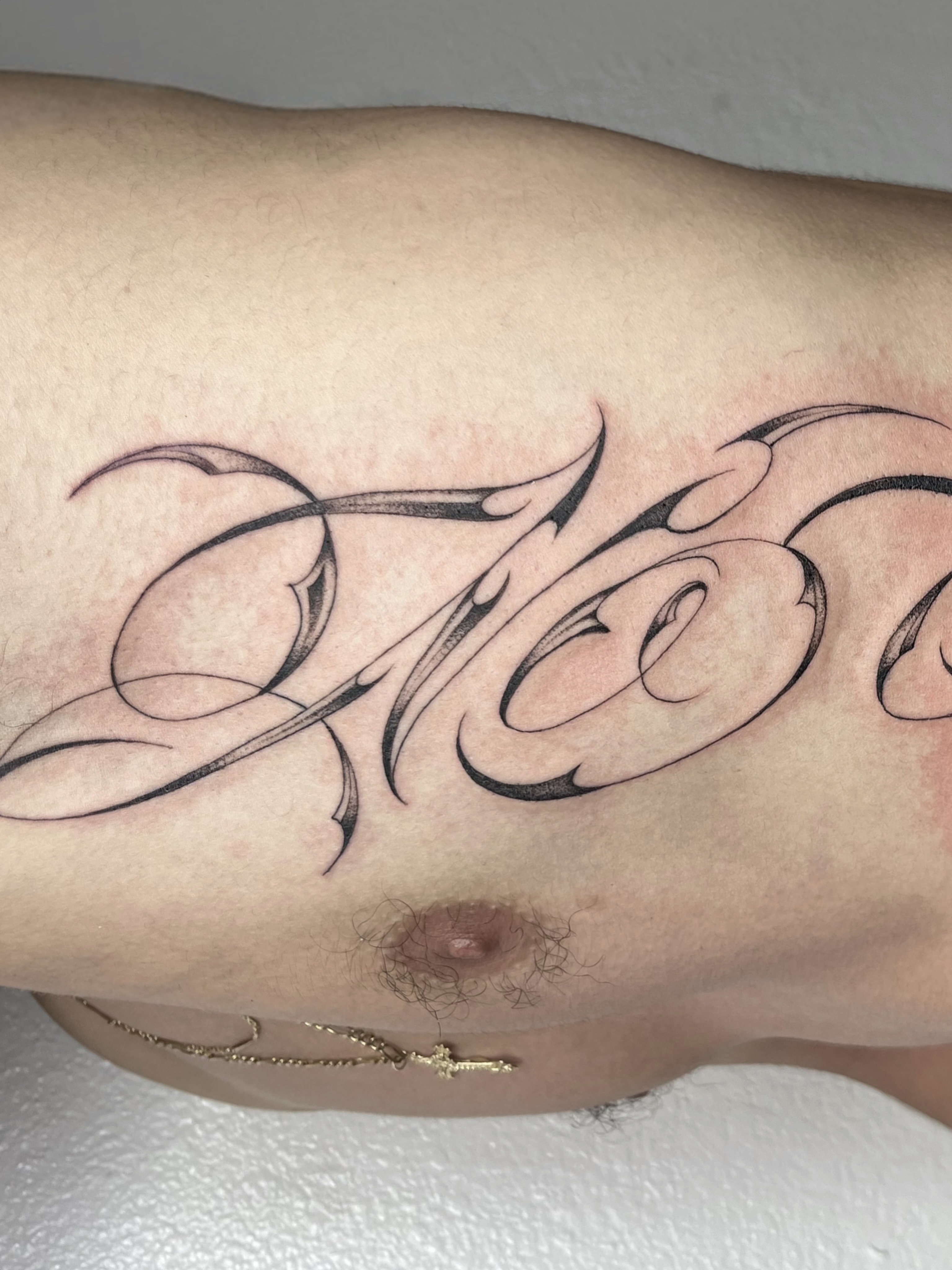 Script lettering lettering script tattoo on the forearm by Sara Atamian, San Diego, California