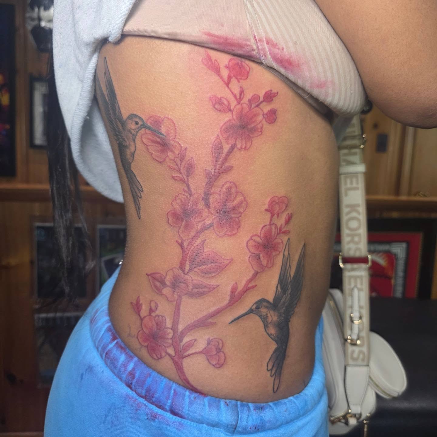 Cherry blossoms and hummingbirds japanese irezumi tattoo on the ribs by Rusty Williams