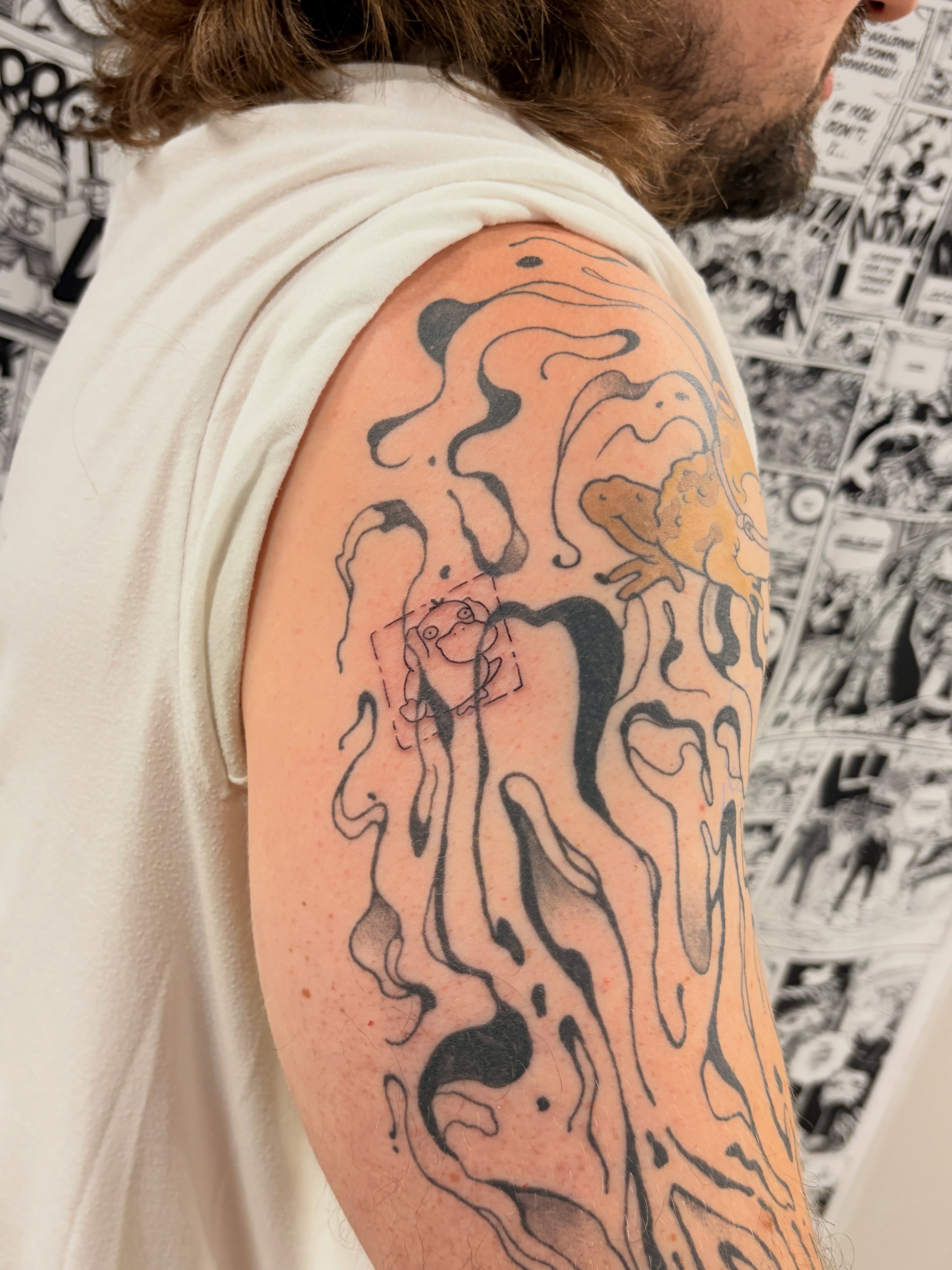 Abstract fluid design tattoo on the upper arm by Chris, Cleveland, Ohio