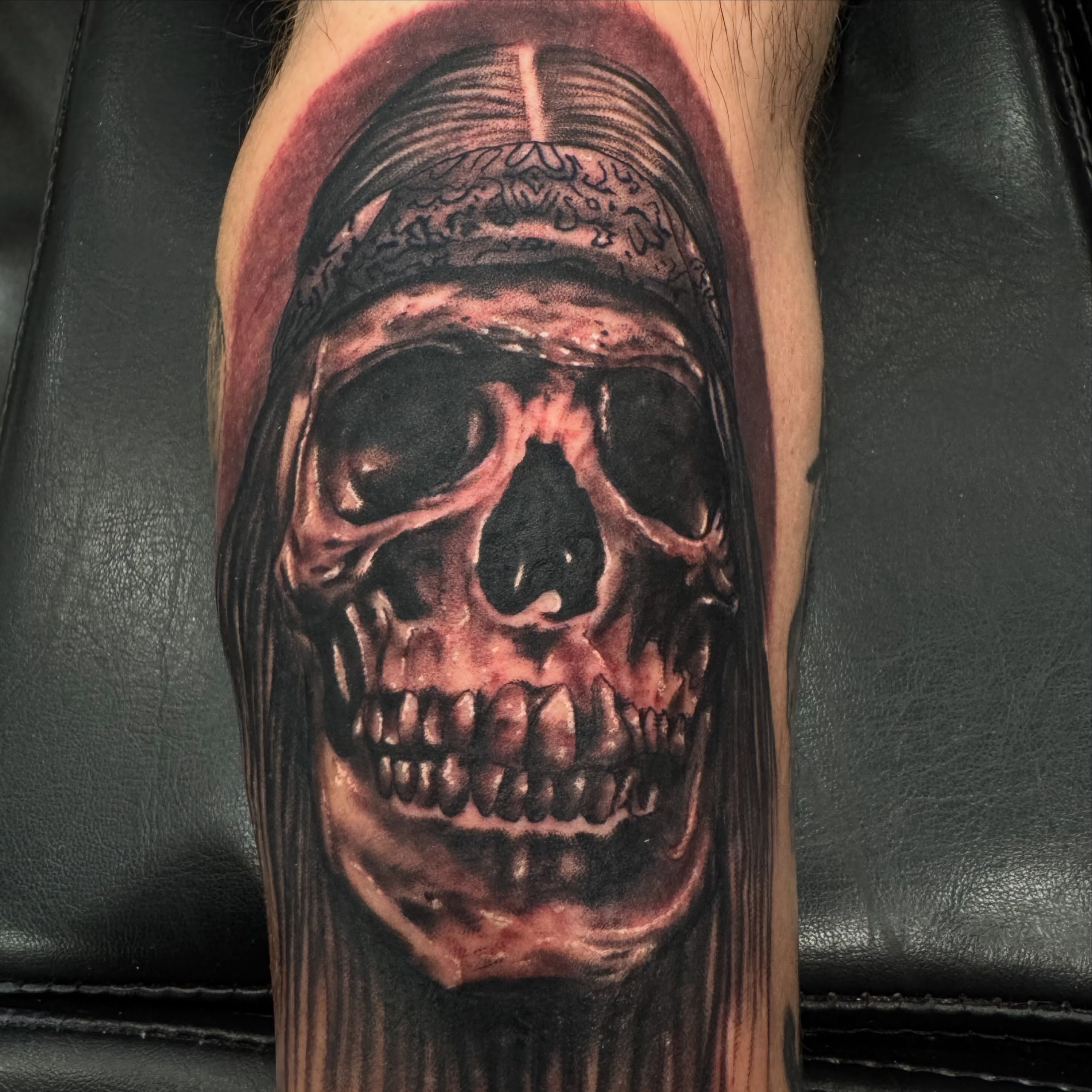 Skull realism tattoo on the forearm by Brian Herrera
