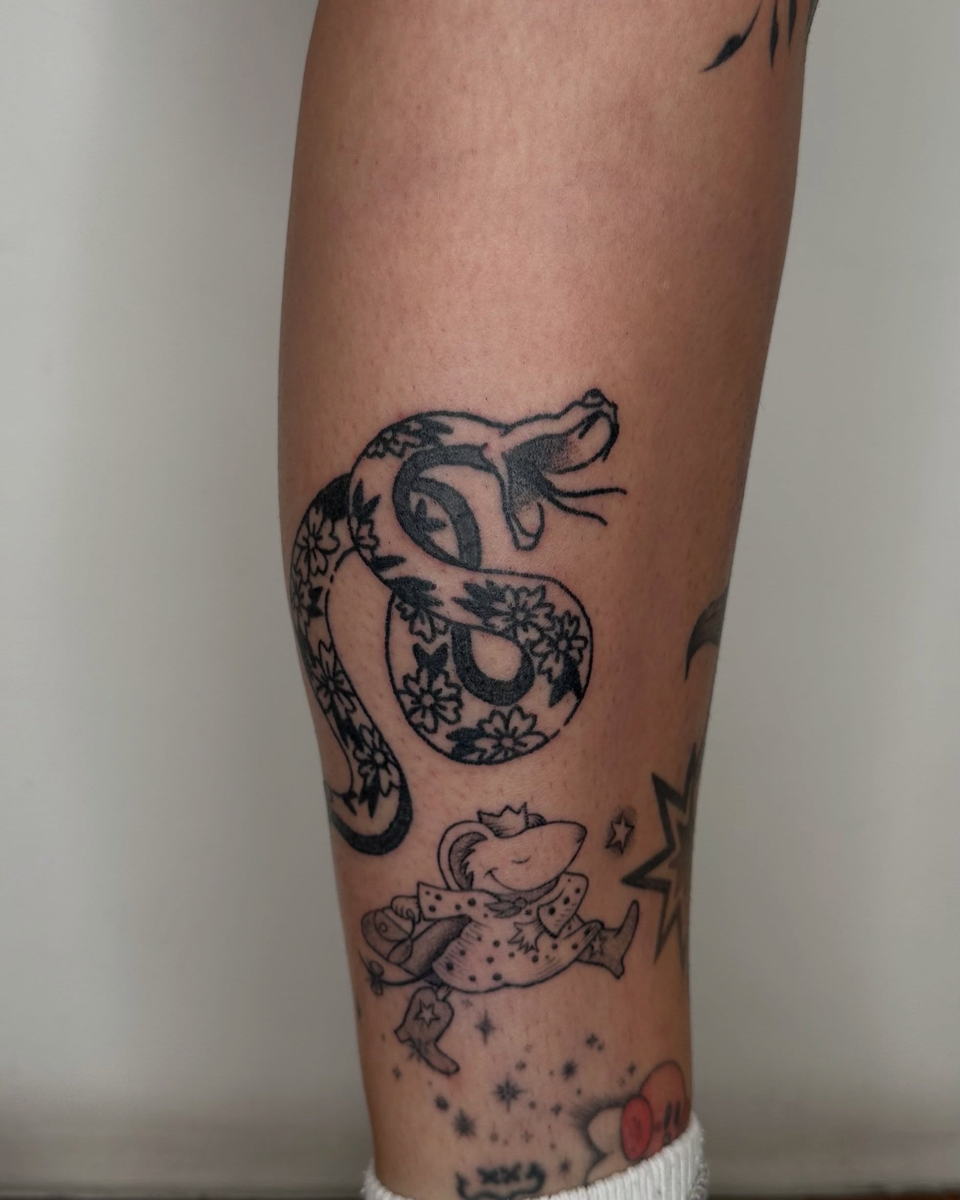 Snake and mouse black and grey tattoo on the forearm by paulina