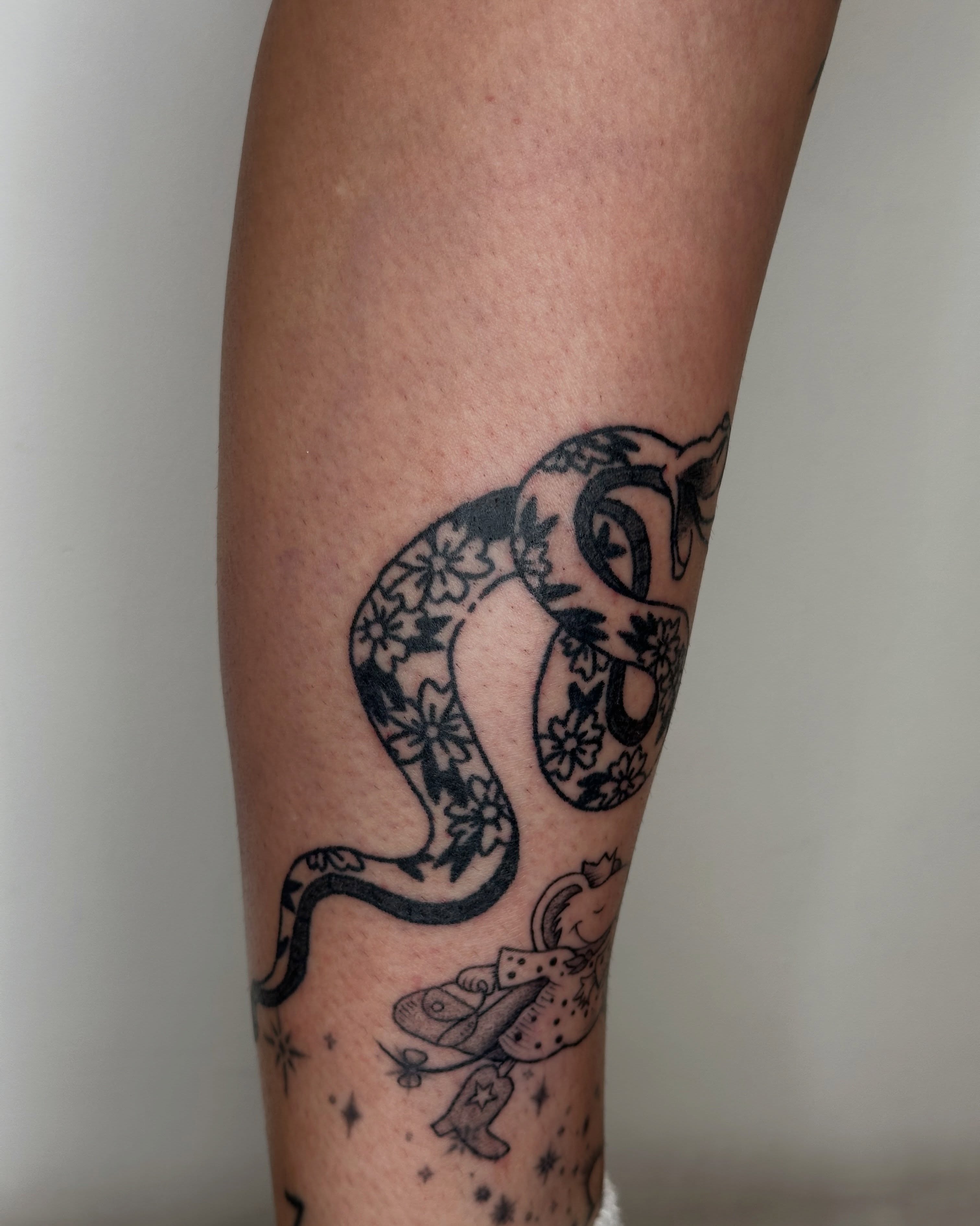 Snake black and grey tattoo on the forearm by paulina