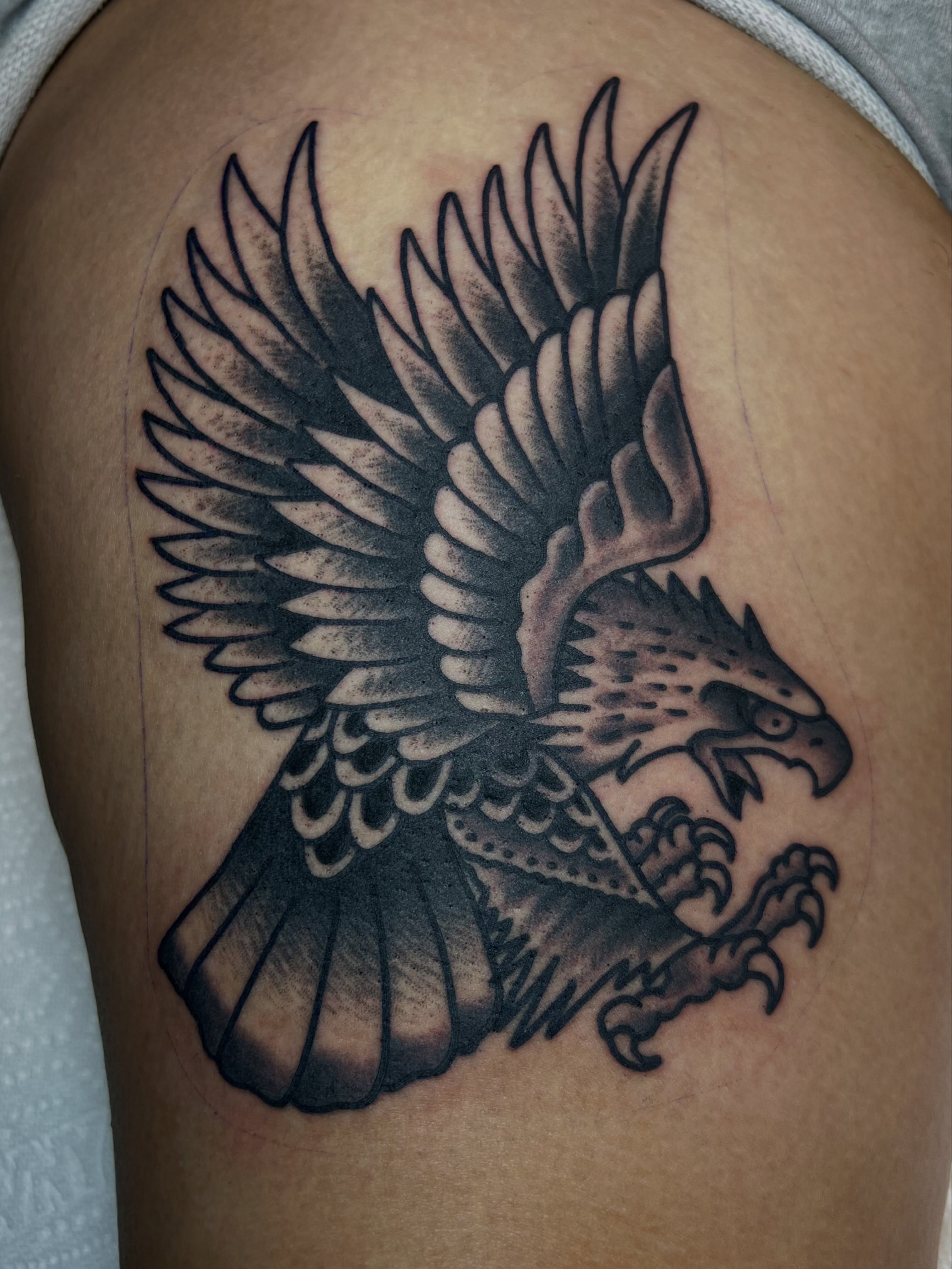 Eagle black and grey tattoo on the thigh by Tattoo