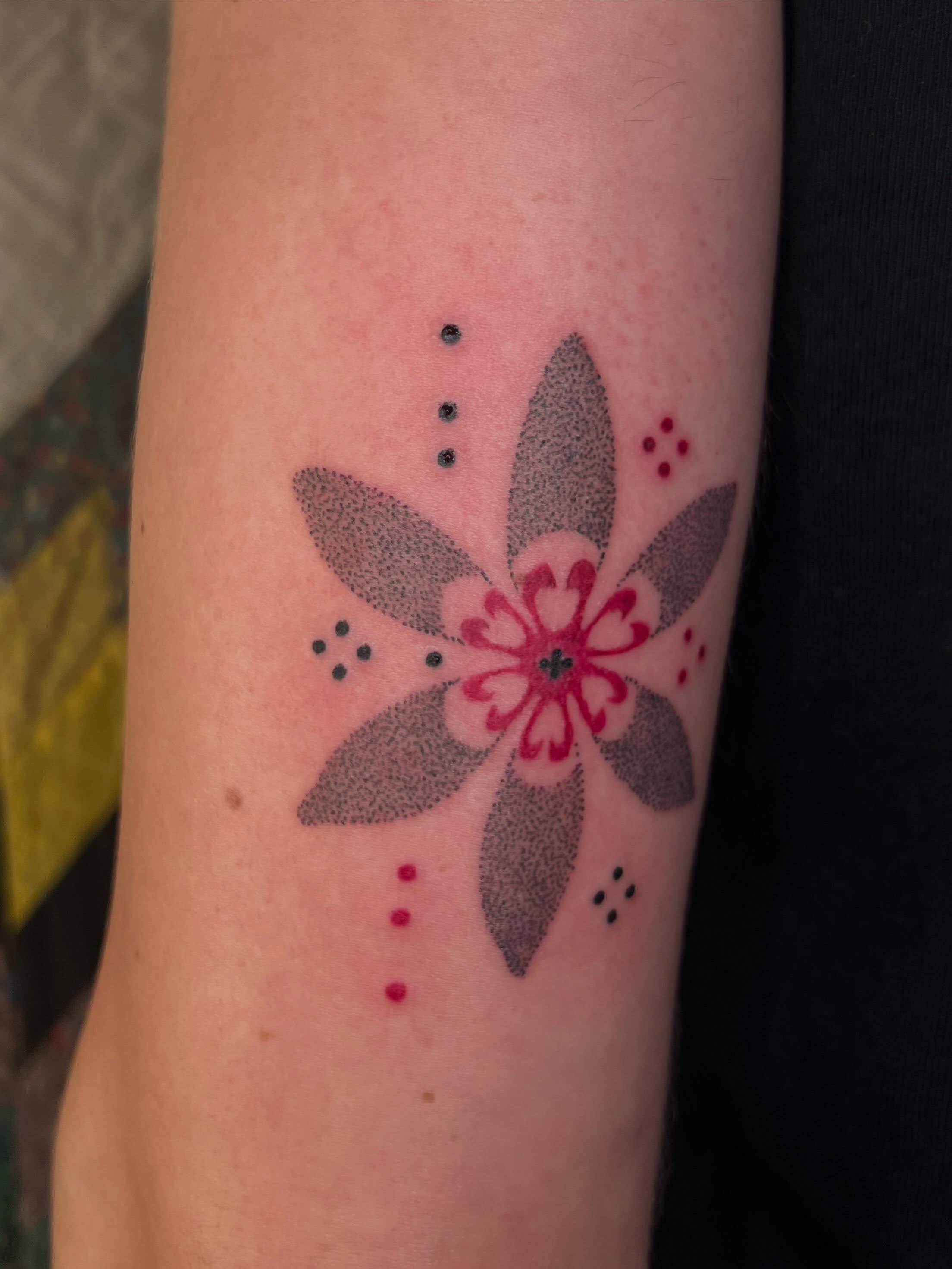 Flower dotwork tattoo on the forearm by faith