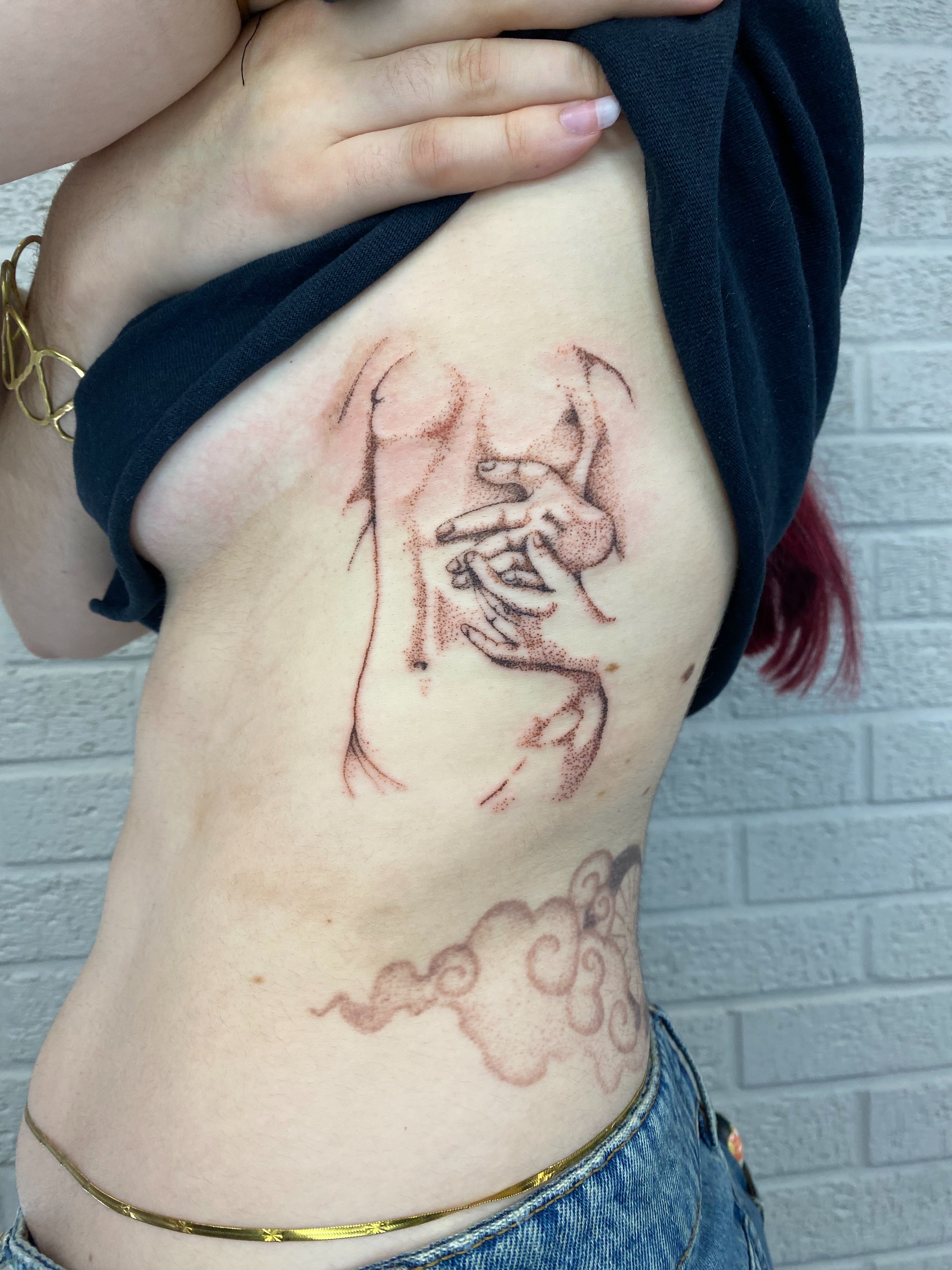 Mother and child dotwork tattoo on the ribs by Ellena Reggiani