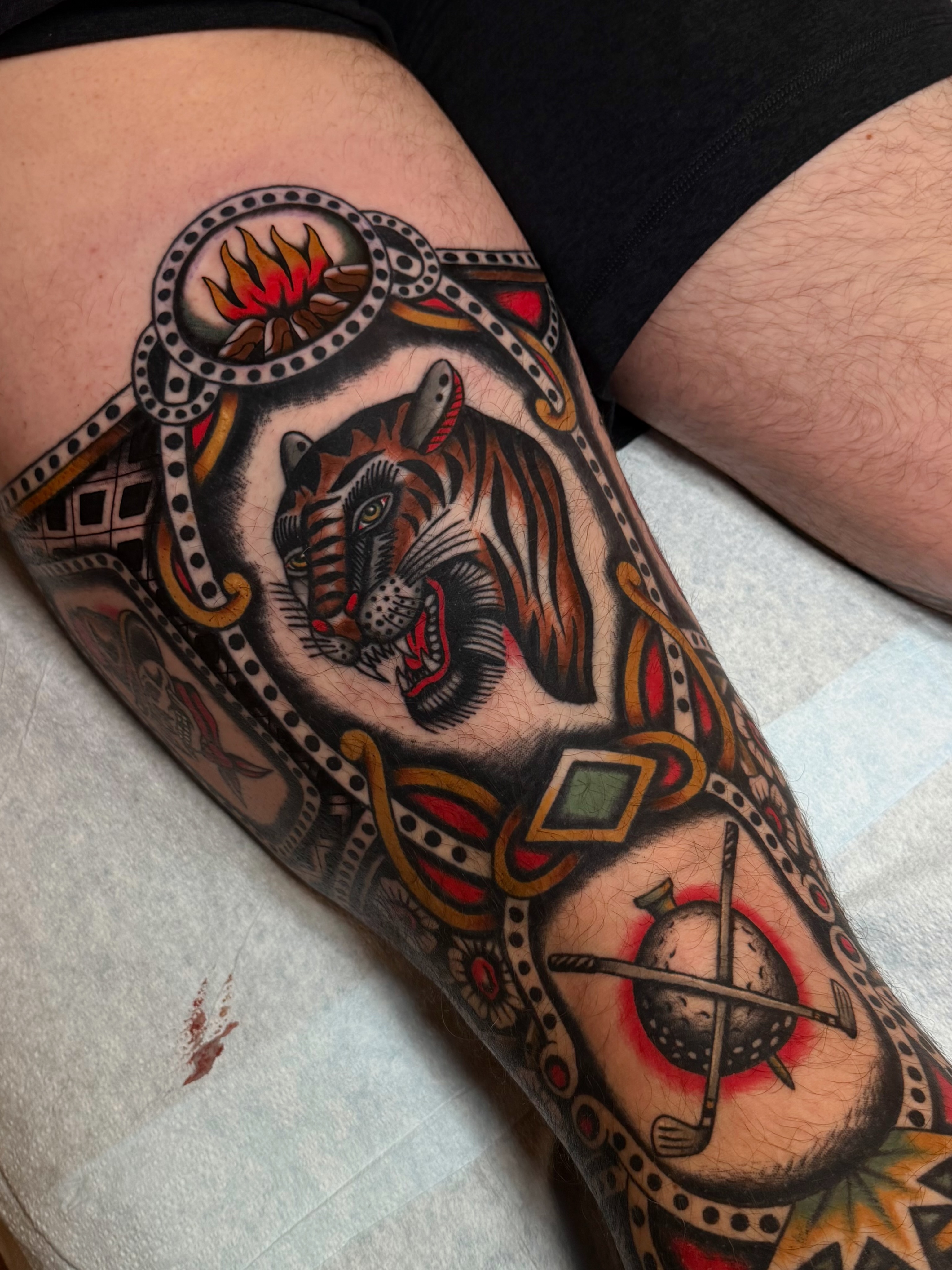 Tiger American traditional tattoo on the thigh by Casey Sullivan, San Diego, California