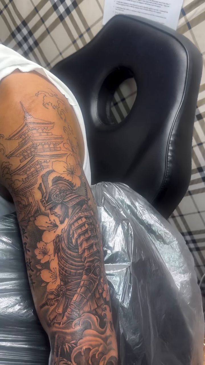 Samurai warrior and pagoda Japanese tattoo on the upper arm by Jose Onasis Disla, New York, New York