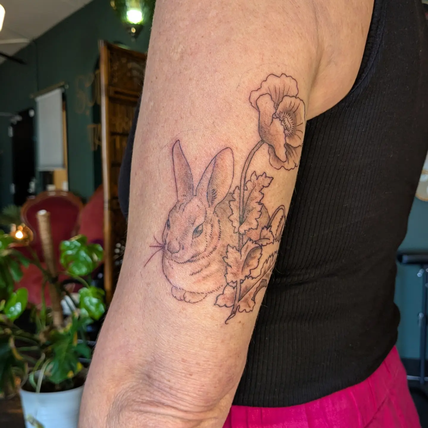 Rabbit and flowers realism tattoo on the forearm by Madison Cañedo ✺ Portland tattoo