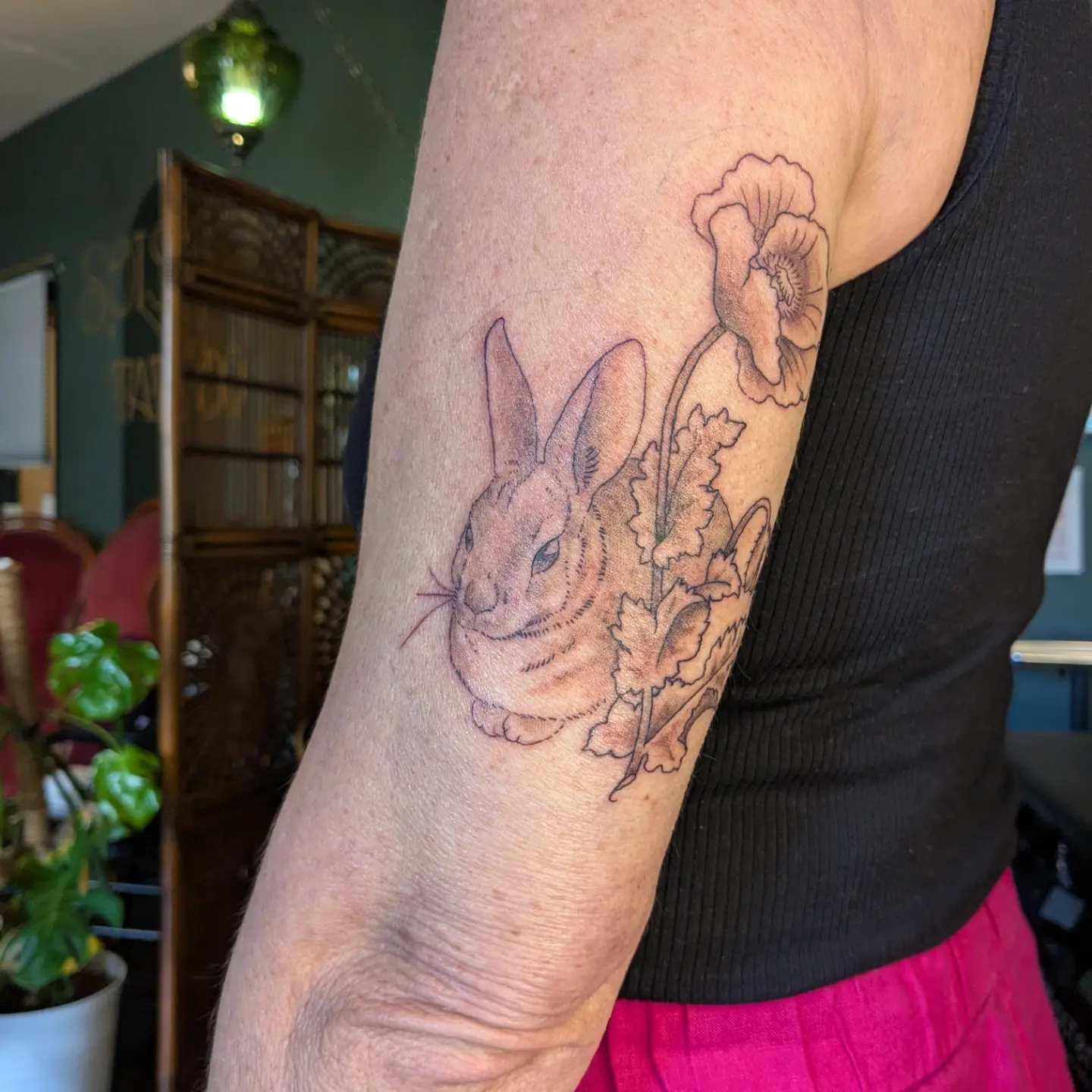 Rabbit and flowers realism tattoo on the forearm by Madison Cañedo ✺ Portland tattoo
