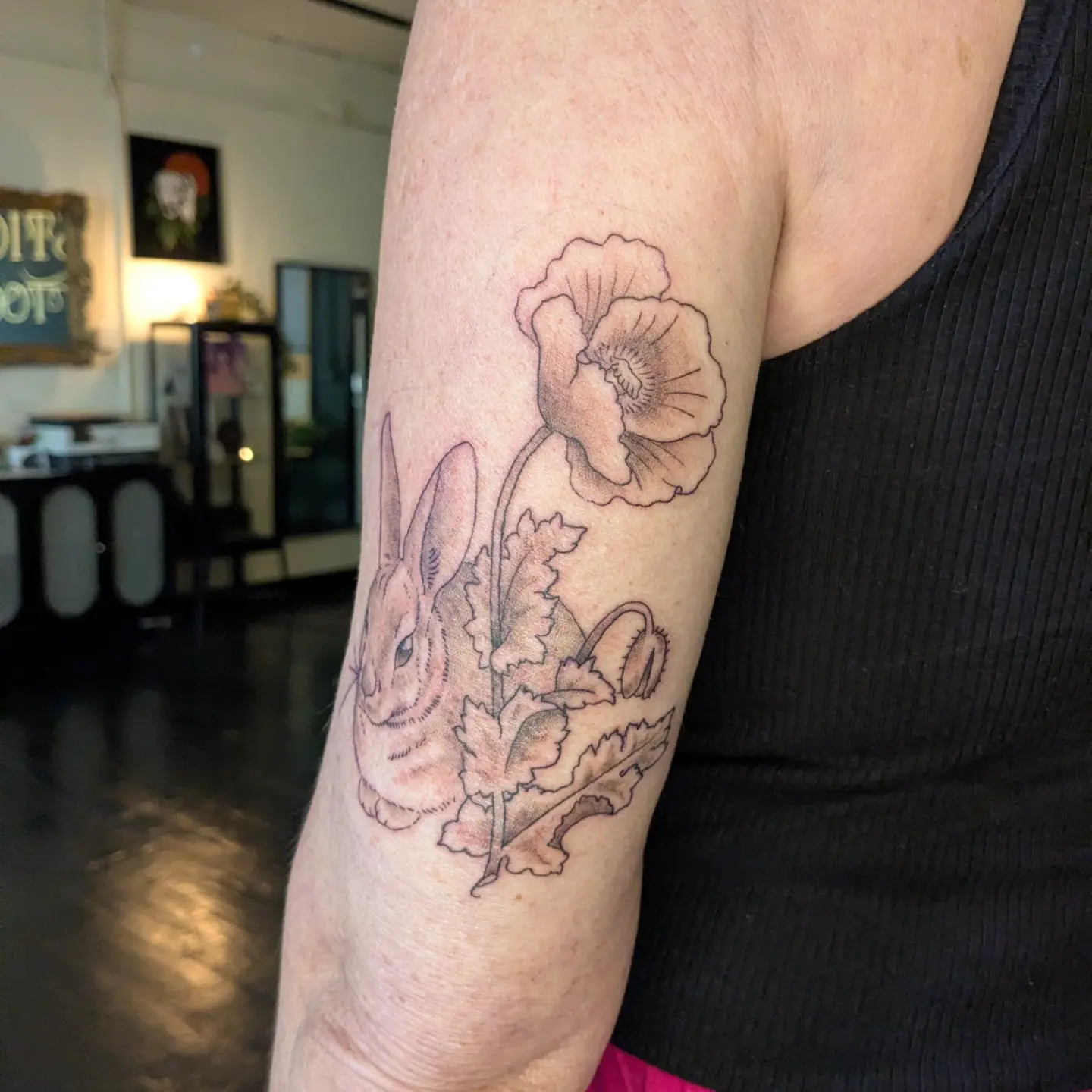 Rabbit and poppy black and grey tattoo on the forearm by Madison Cañedo ✺ Portland tattoo