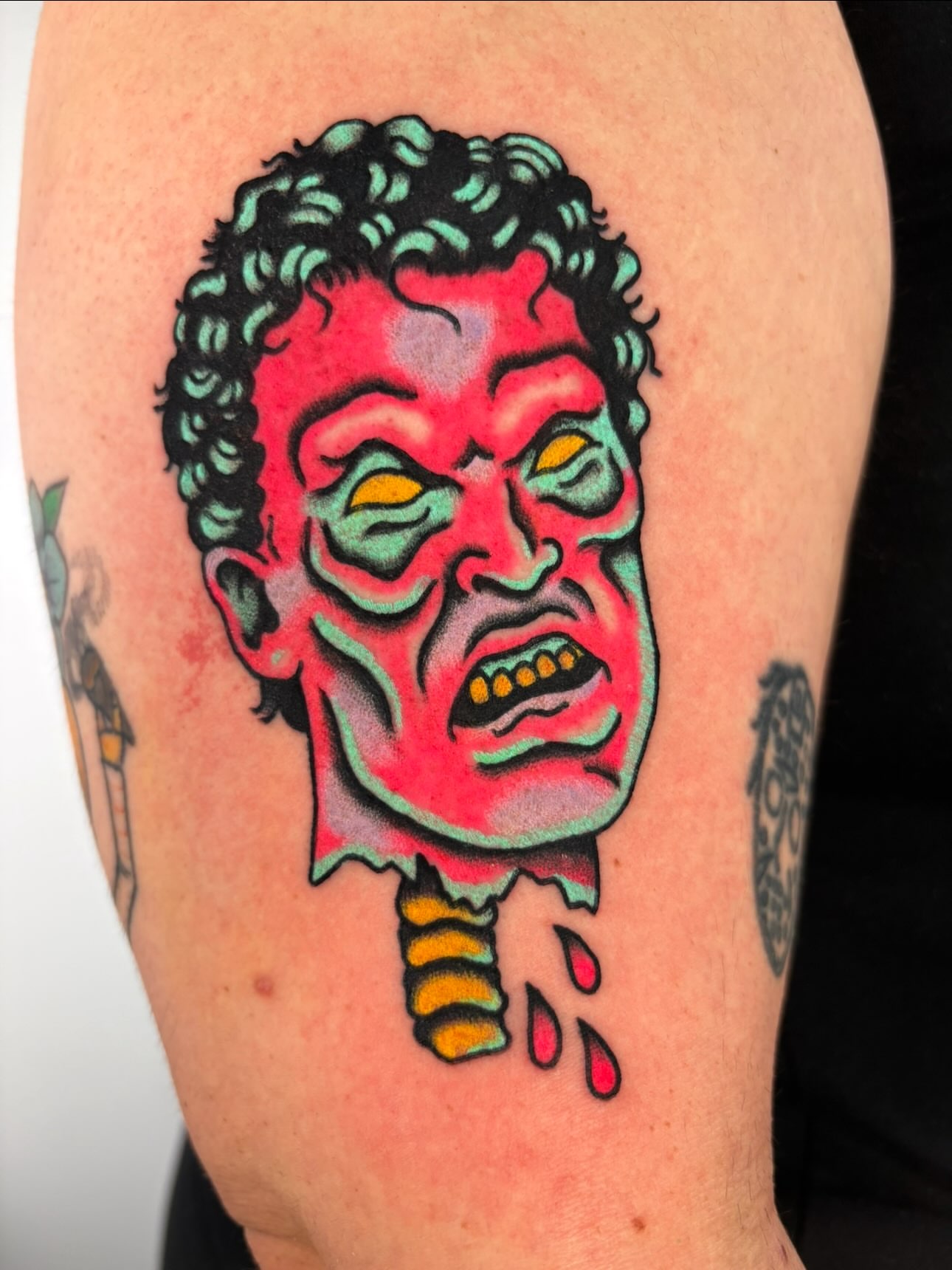Zombie head American traditional tattoo on the thigh by Lorelei